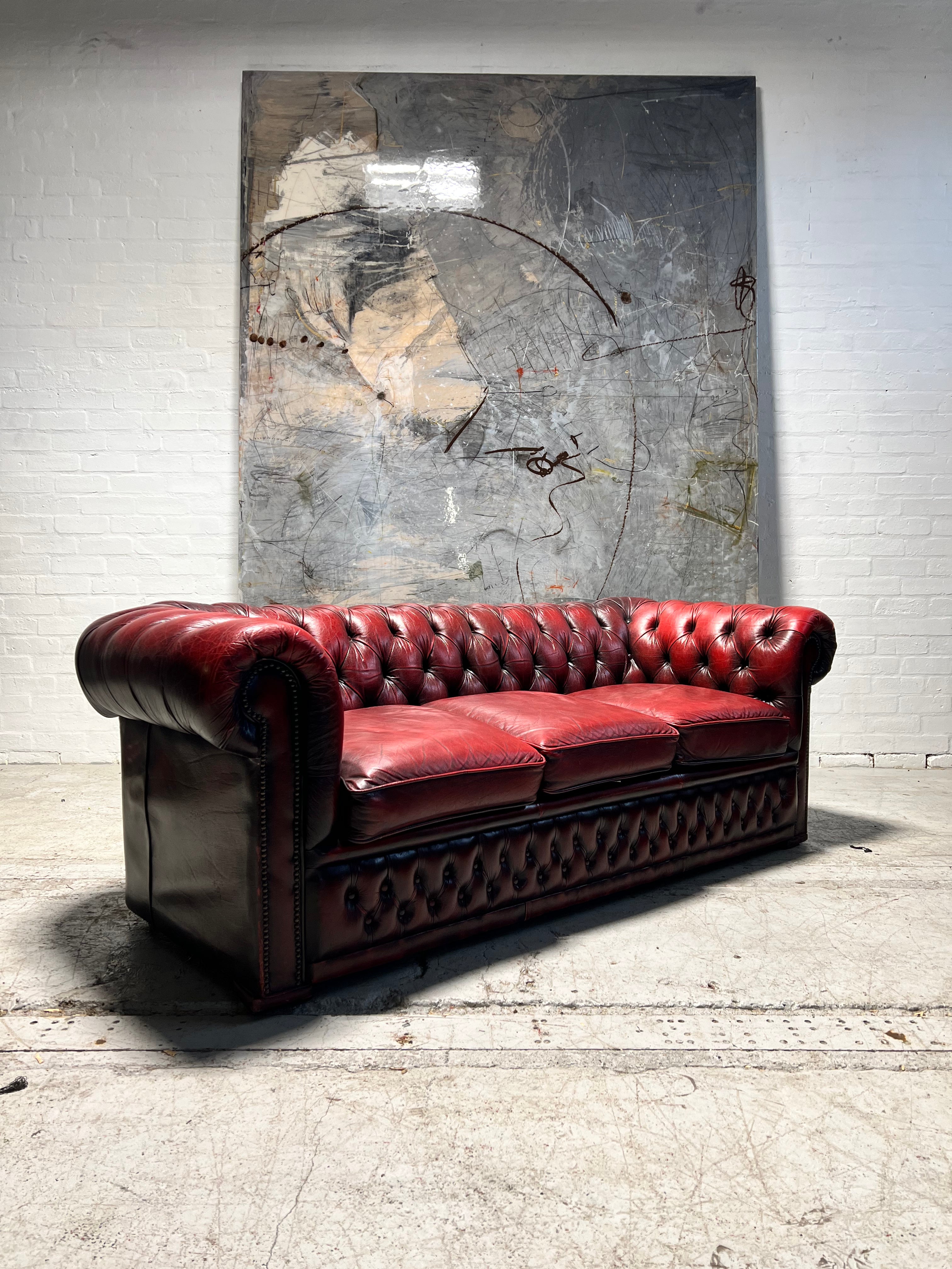 A Very Nice Leather Chesterfield 3 Seater Sofa in Reds