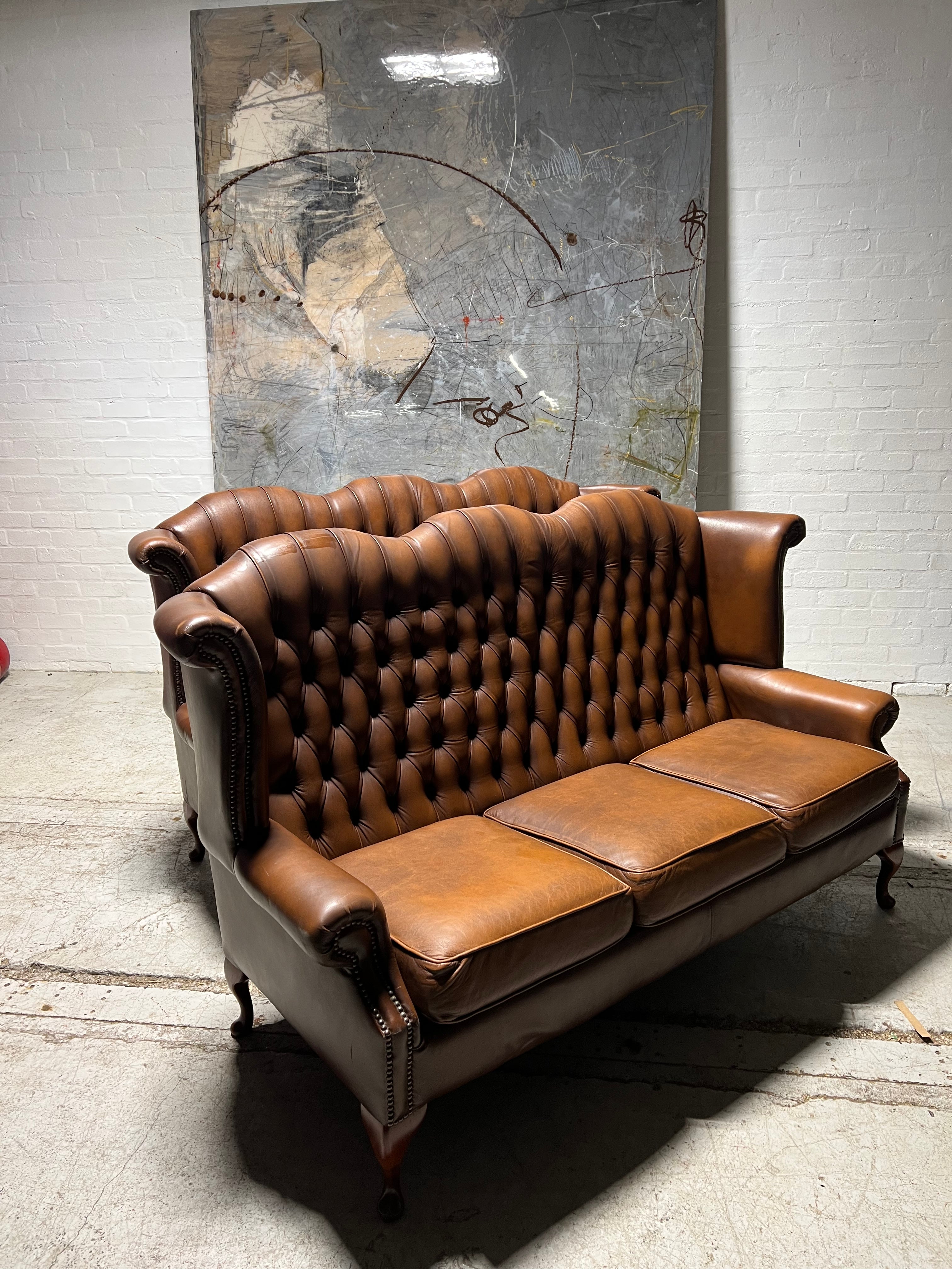 Beautiful Pair of Twice loved Chesterfield Wing Back Sofas in Caramel Tan