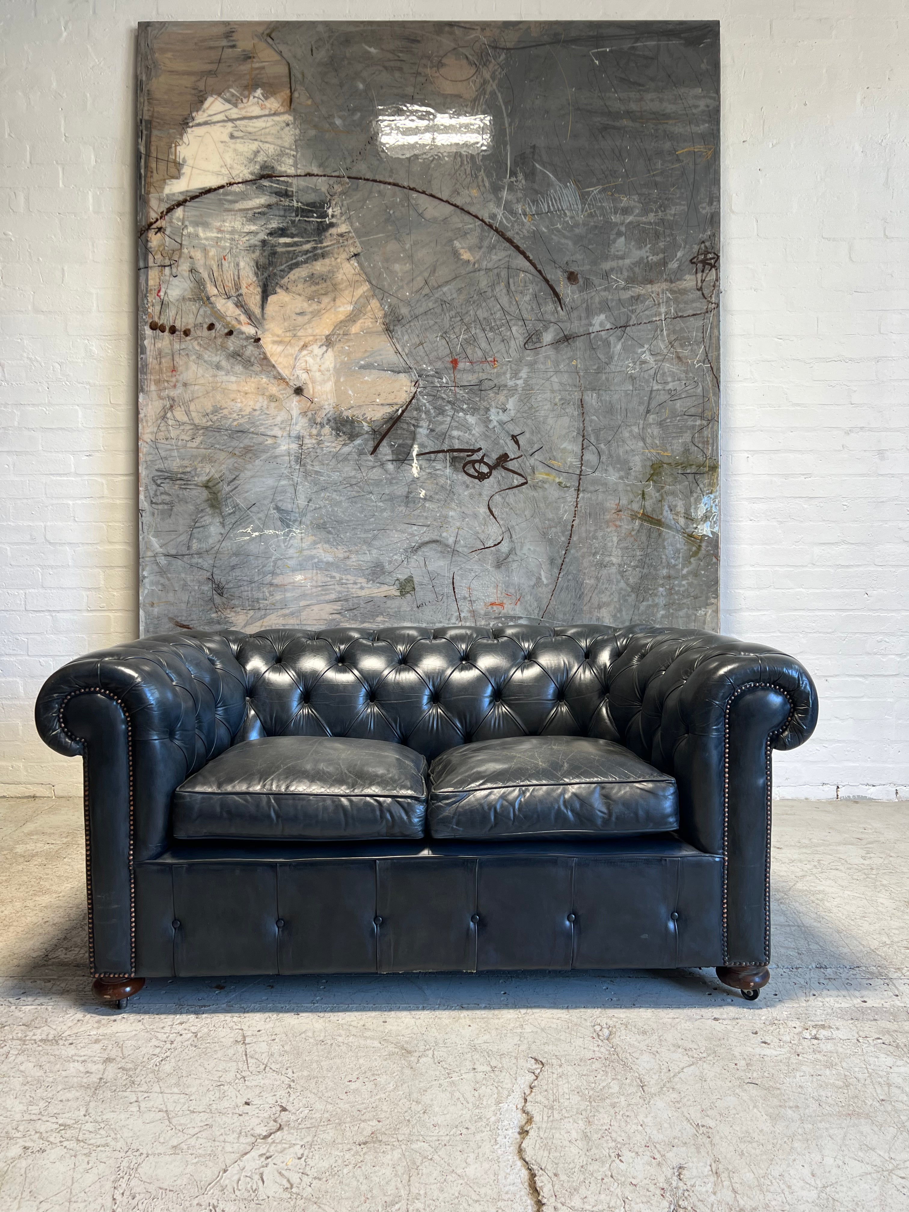 One of An Incredible Pair of MidC Hand Dyed Leather Chesterfield Sofas