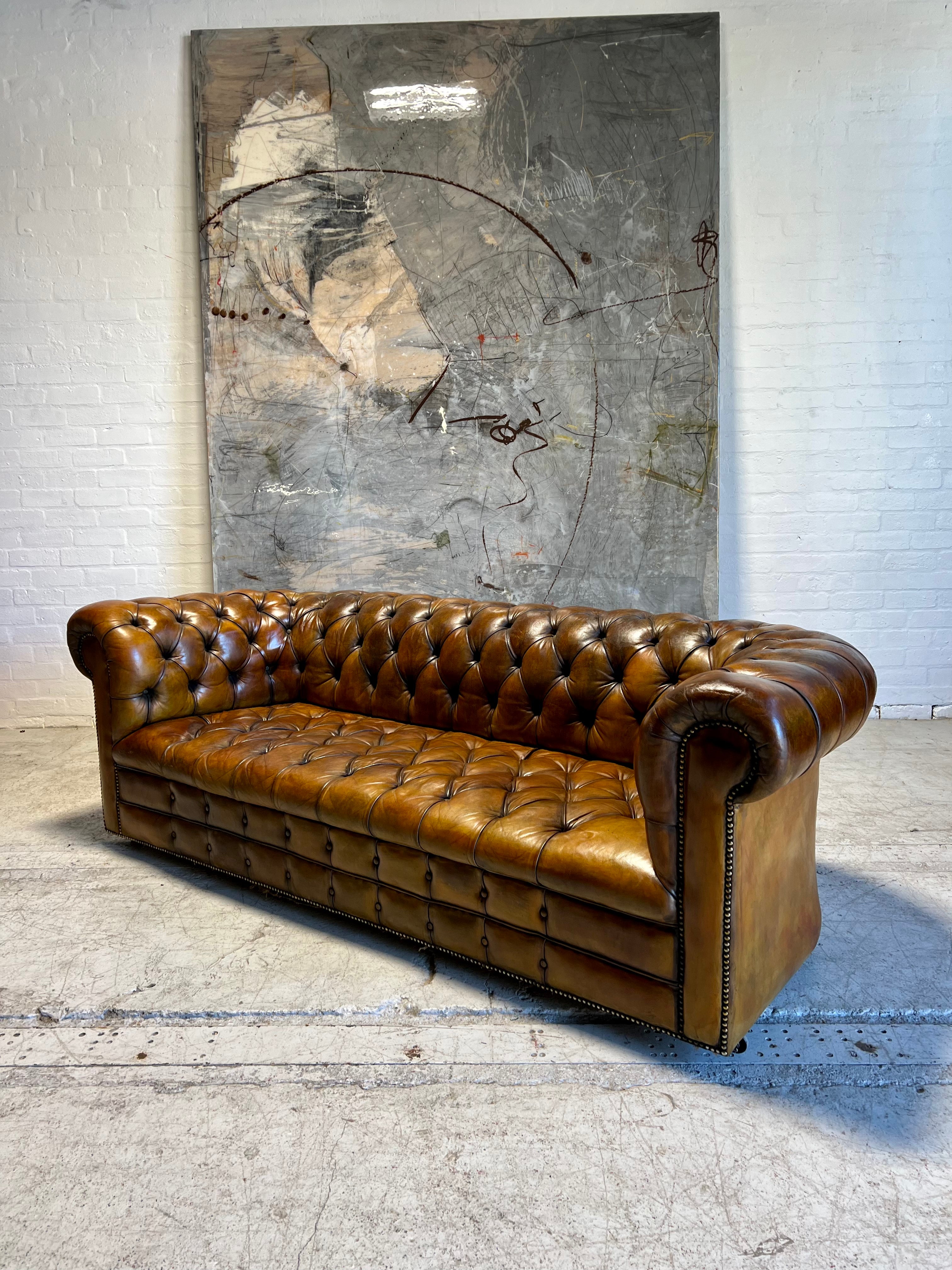 An Exceptional MidC Vintage Hand Dyed Leather Chesterfield Sofa (Matching Club Chairs Available)