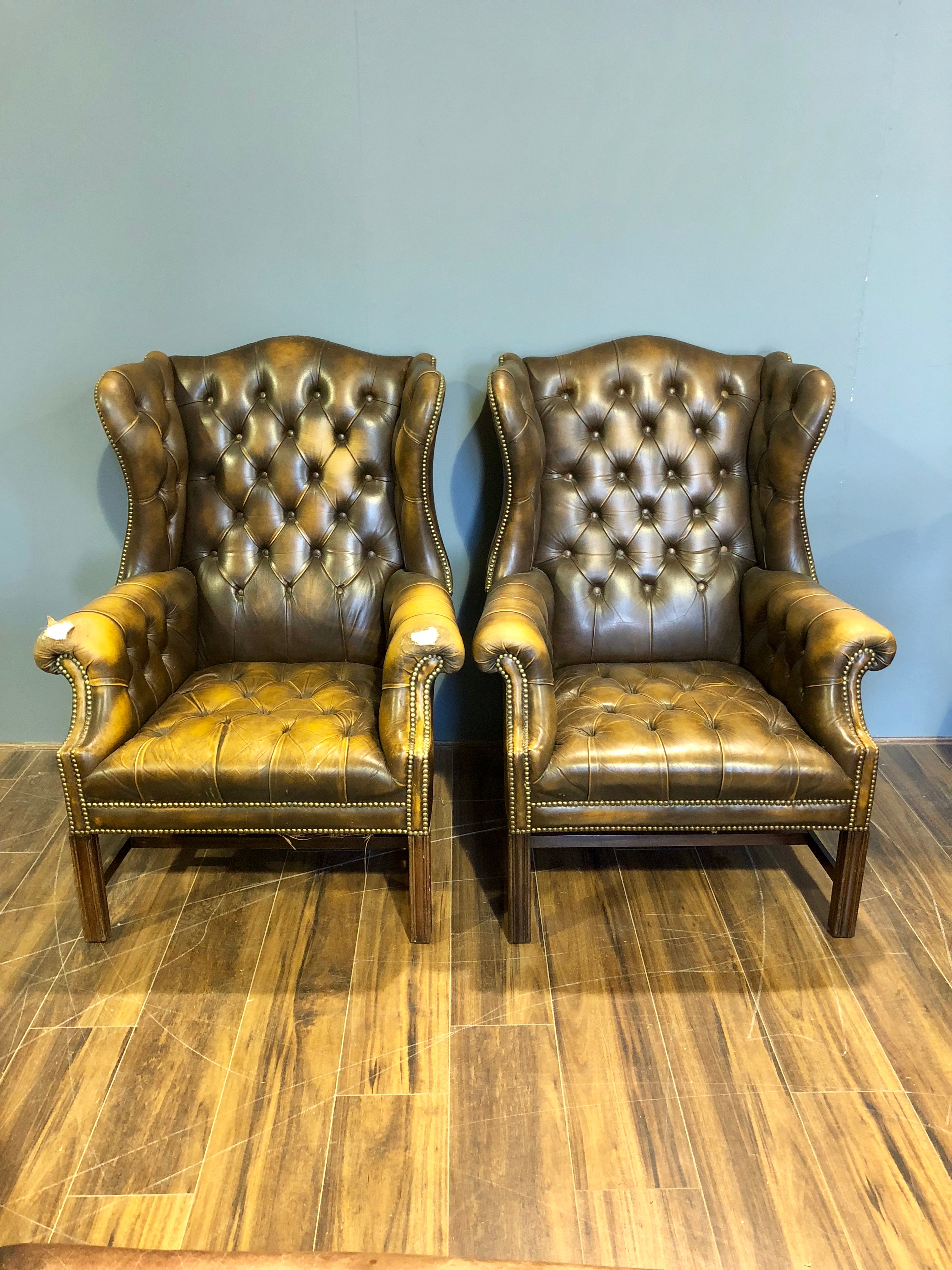 Vintage wing back chairs in Tobacco browns