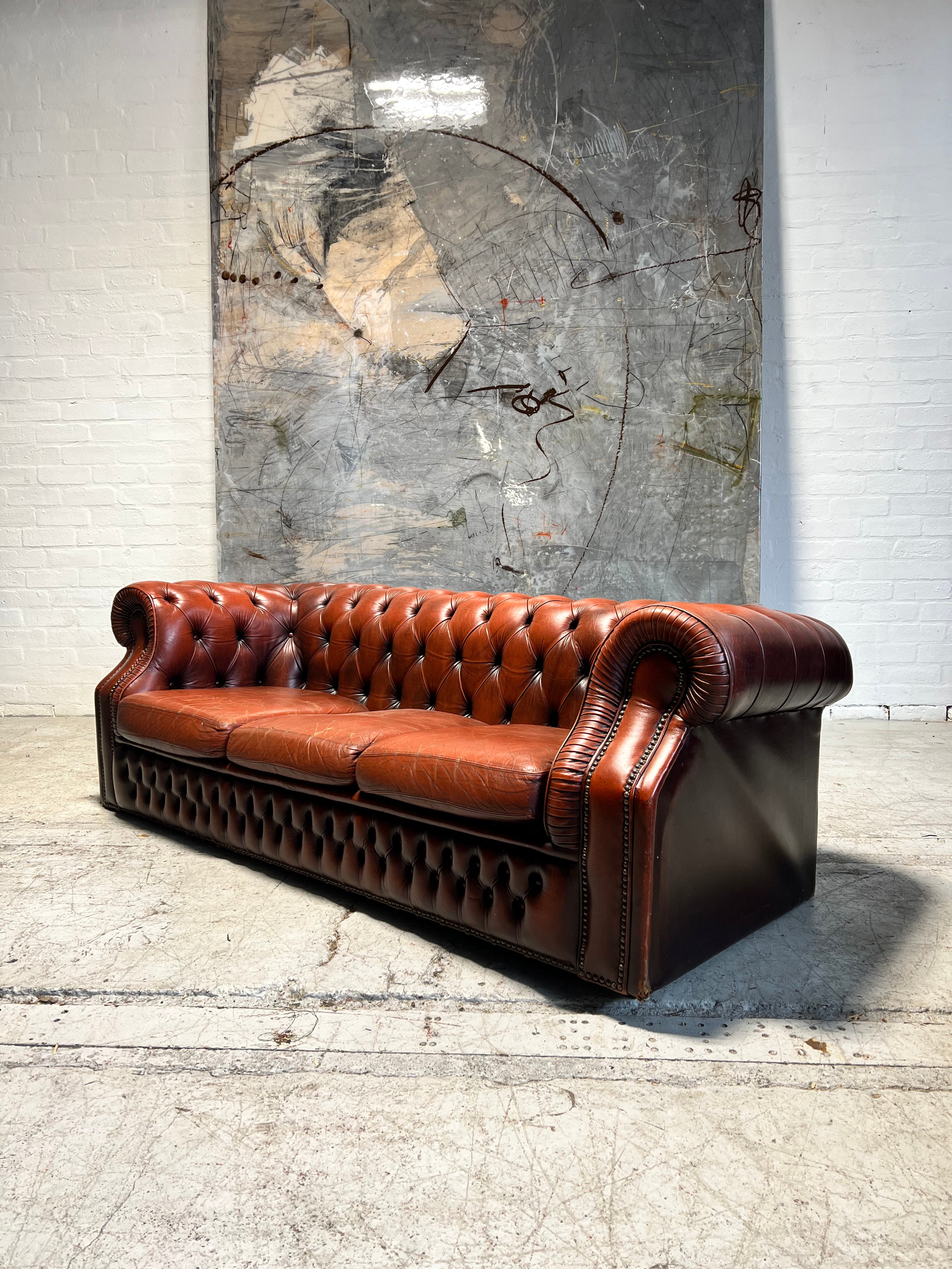 A Rich Chestnut Leather Chesterfield Sofa