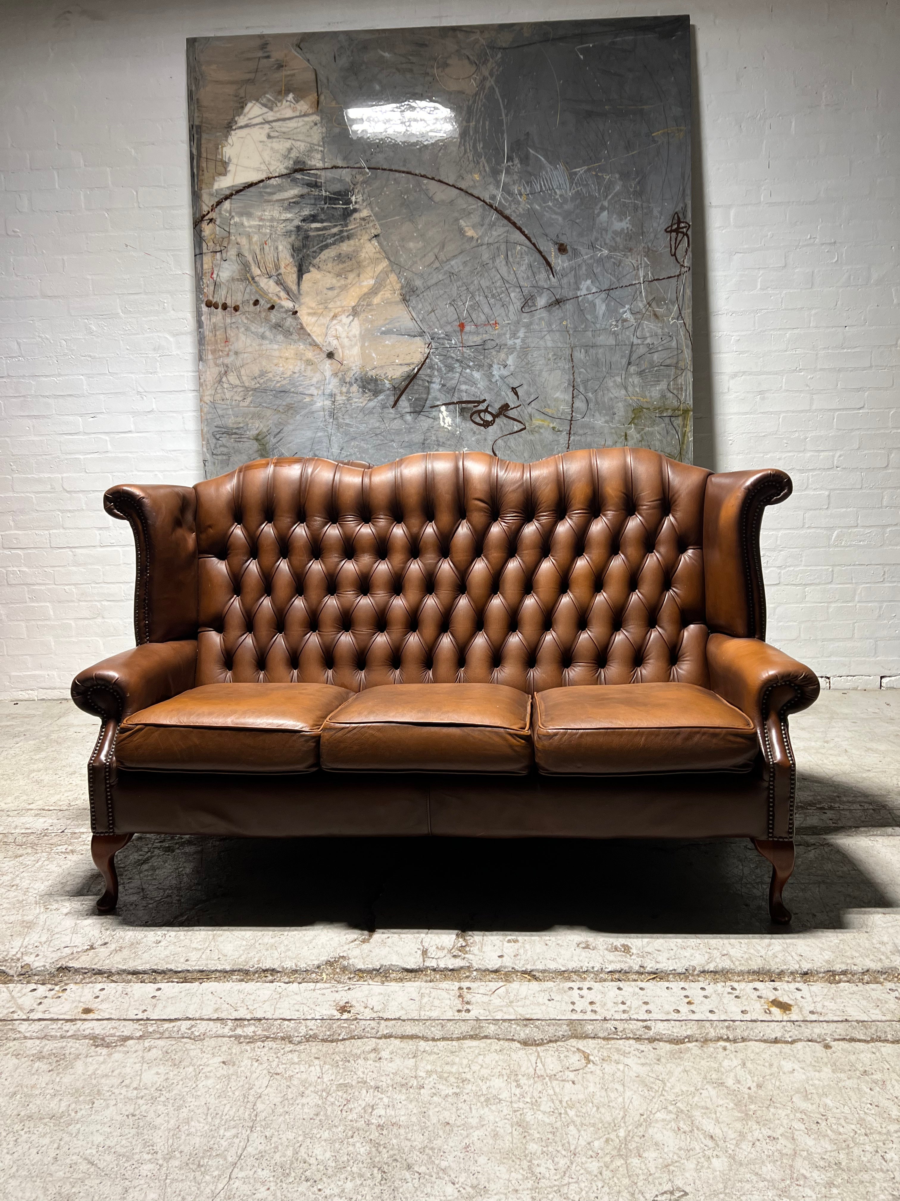 Beautiful Pair of Twice loved Chesterfield Wing Back Sofas in Caramel Tan