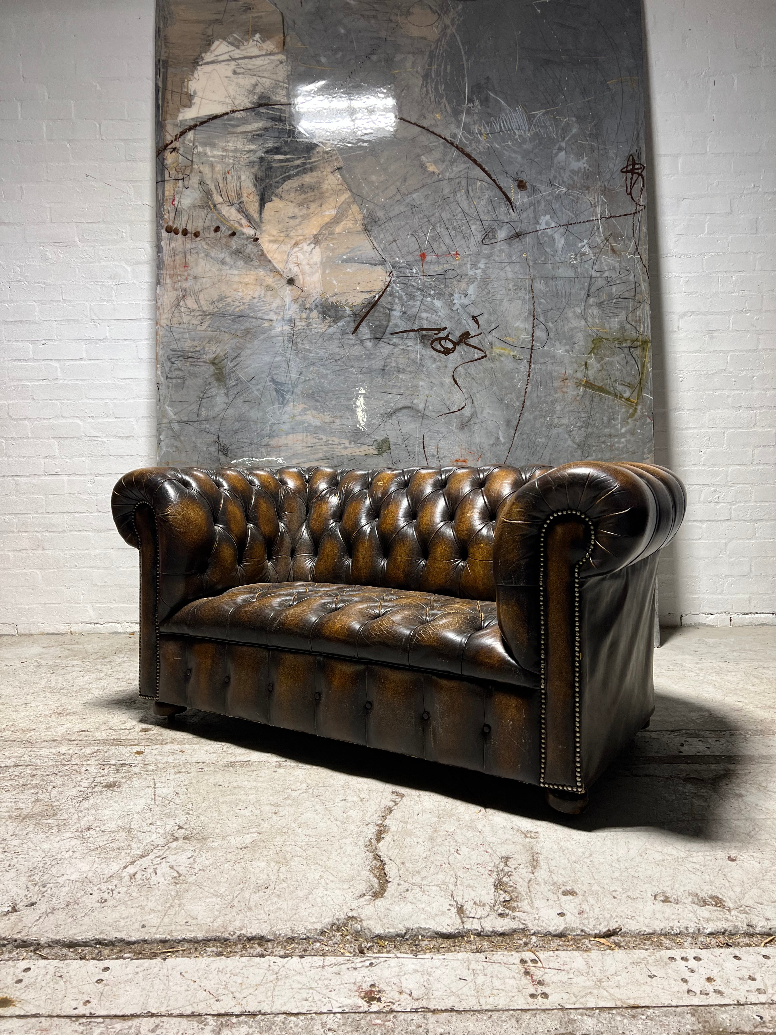 A Very Nice Twice Loved Vintage 2 Seat Leather Chesterfield Sofa in Dark Saddle Tan