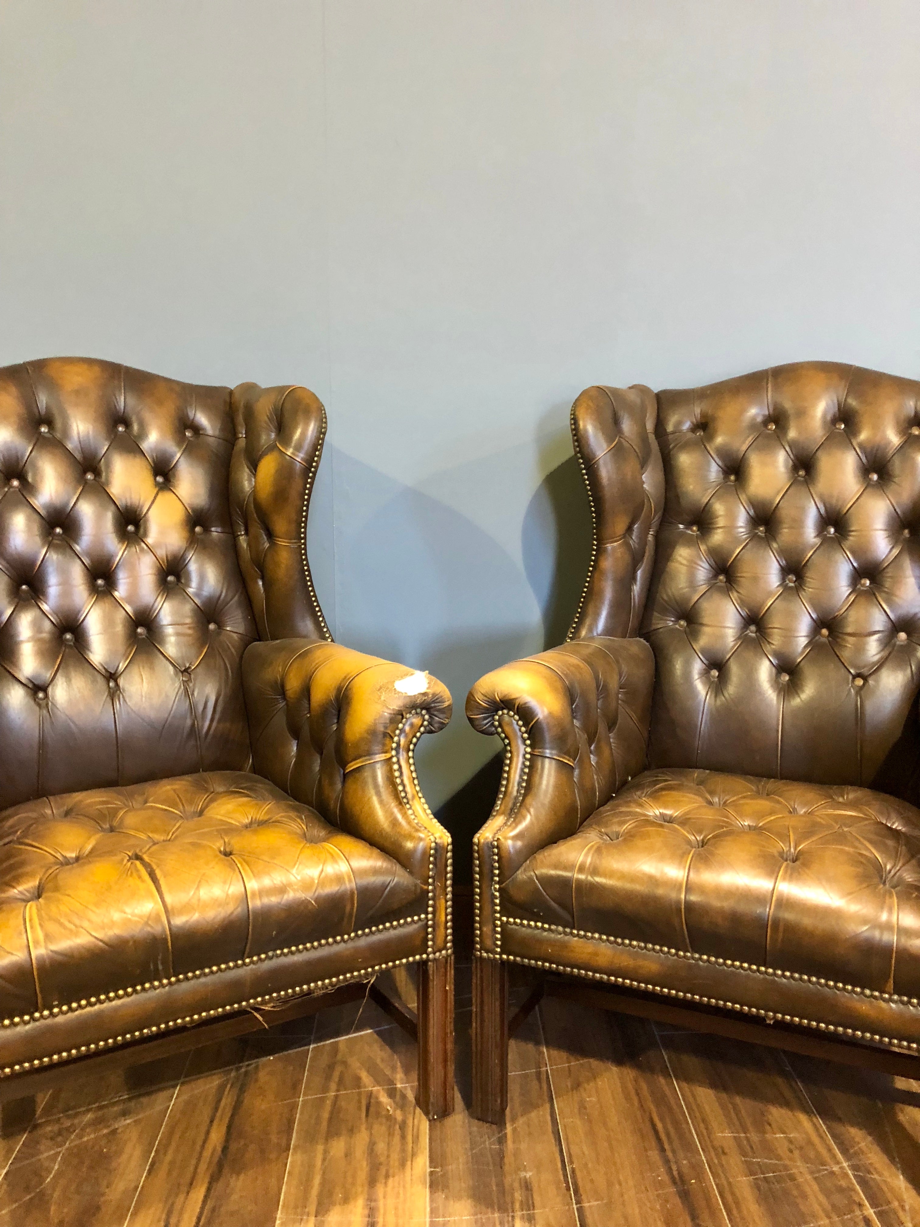 A Super Matching Pair of Vintage Leather Chesterfield Wing Back Chairs