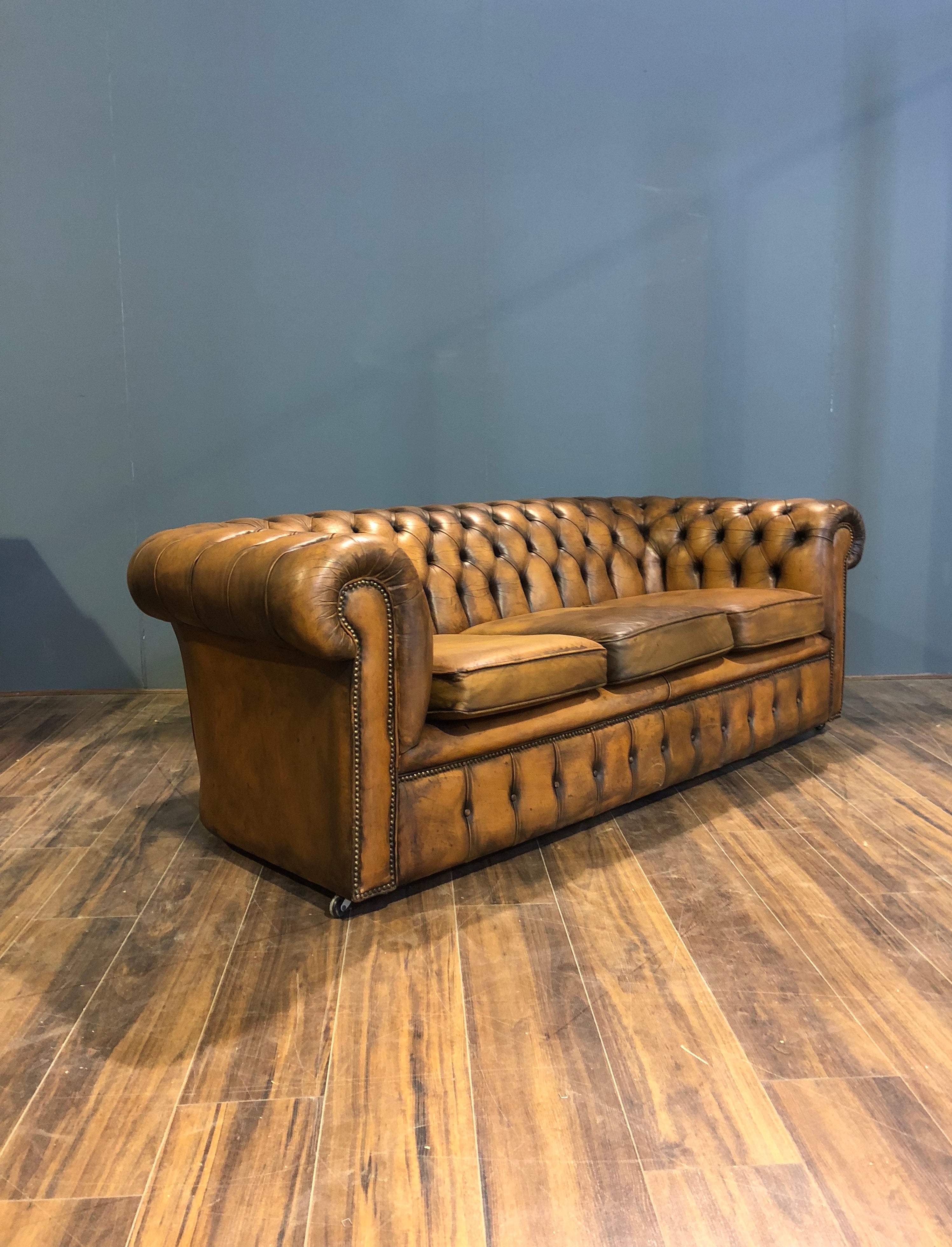 A Very Very Cool Matching Pair of Vintage Leather Chesterfield Sofas in a rustic Golden Tan