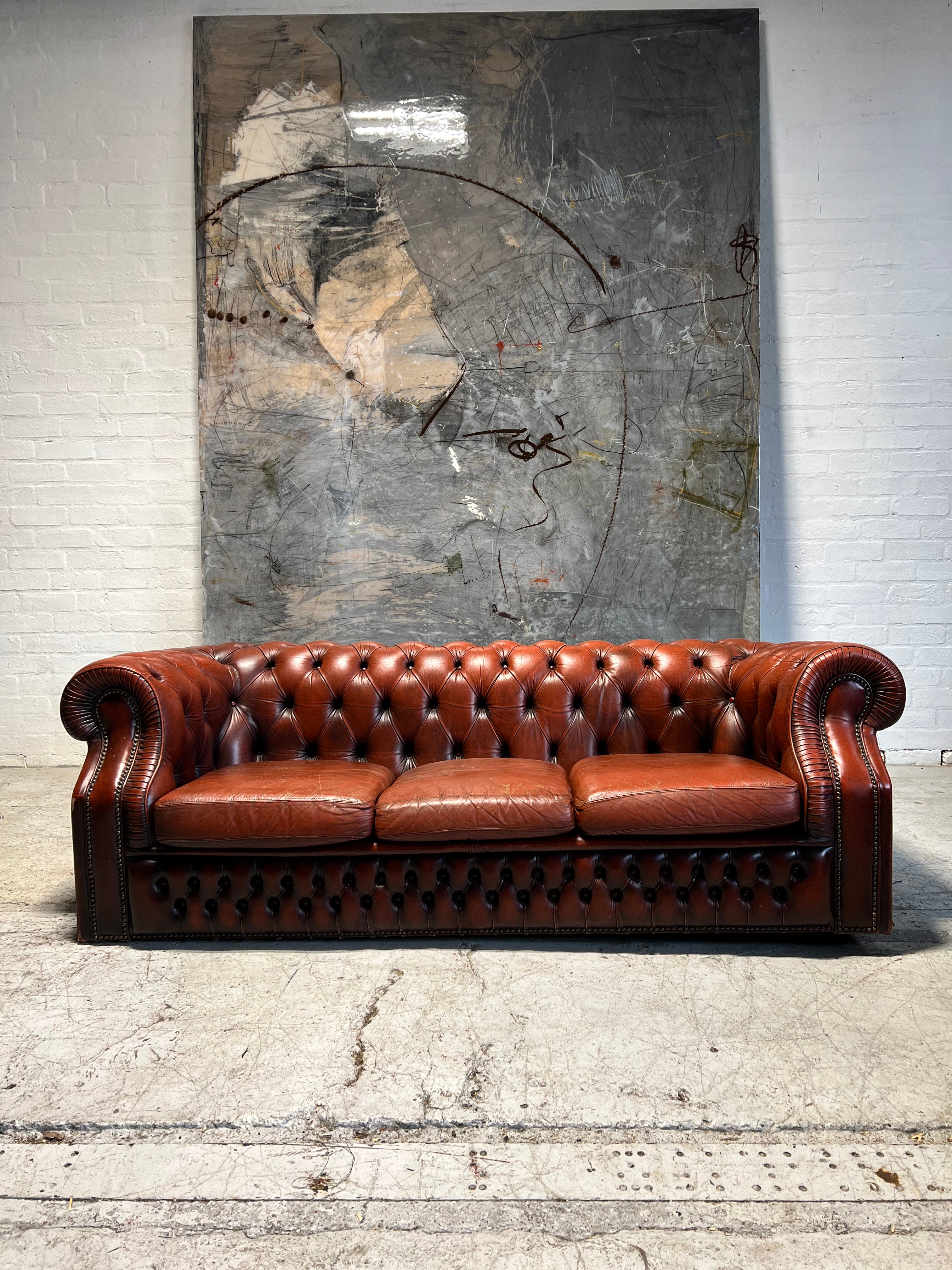 A Rich Chestnut Leather Chesterfield Sofa