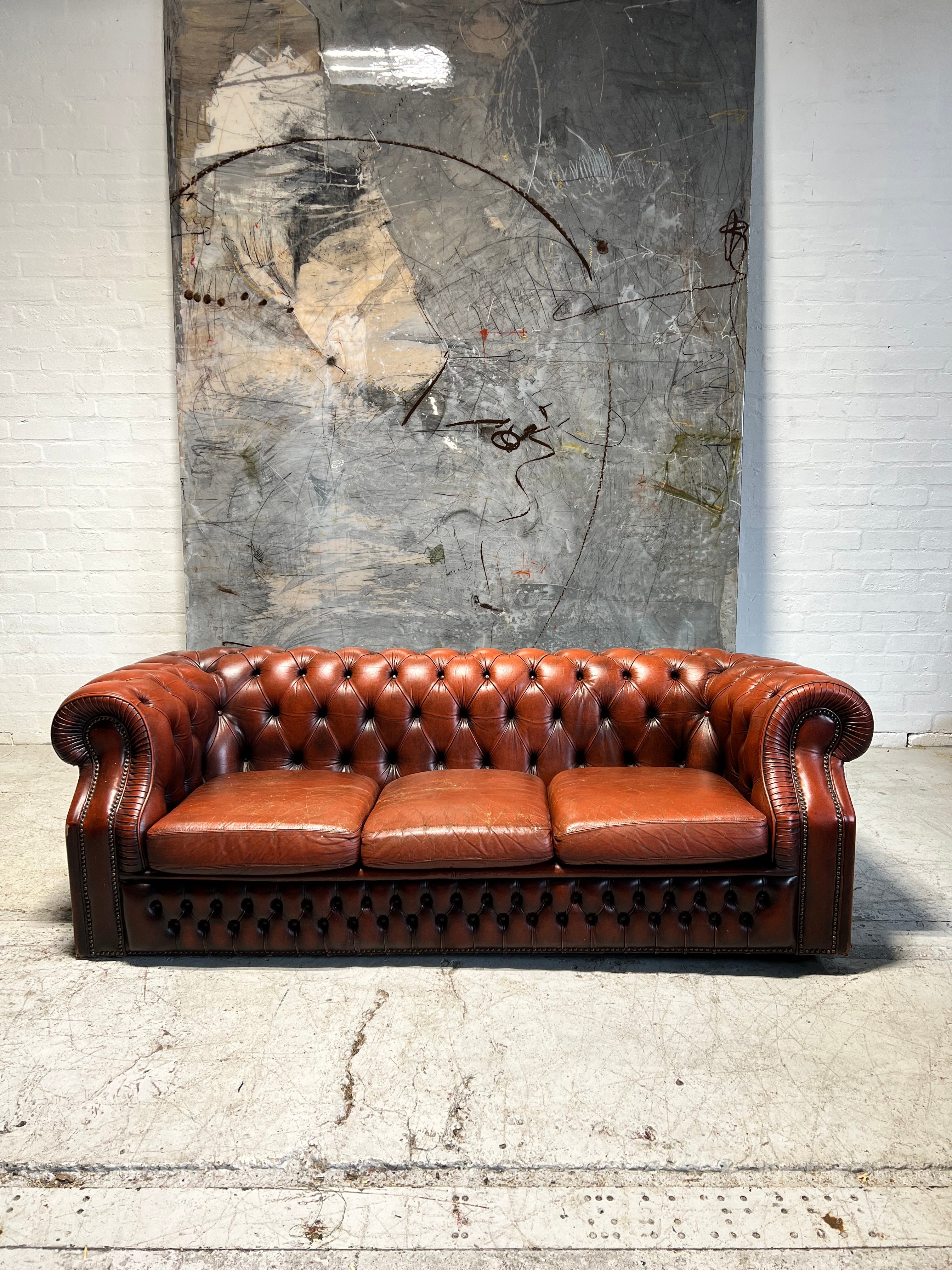 A Rich Chestnut Leather Chesterfield Sofa