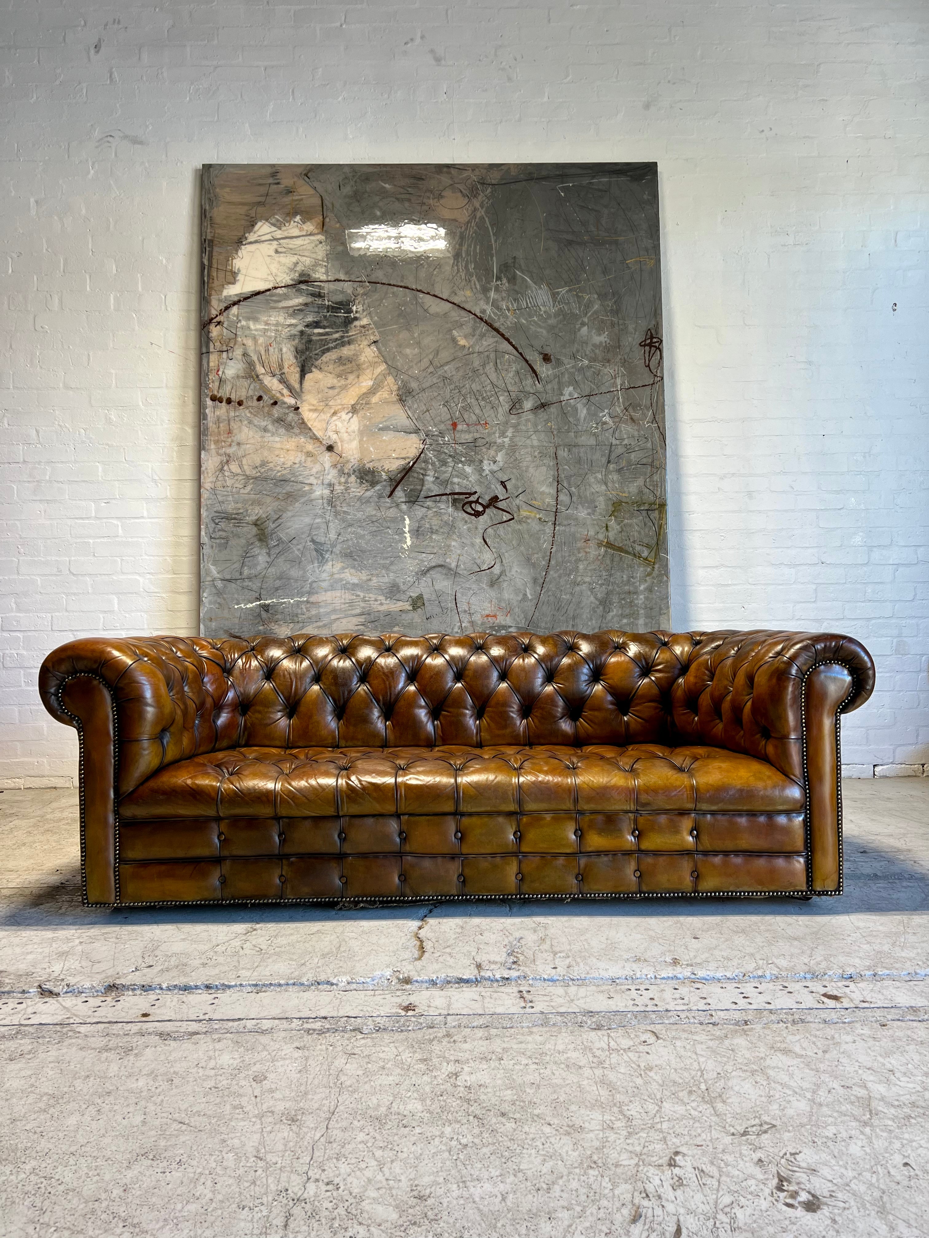 An Exceptional MidC Vintage Hand Dyed Leather Chesterfield Sofa (Matching Club Chairs Available)