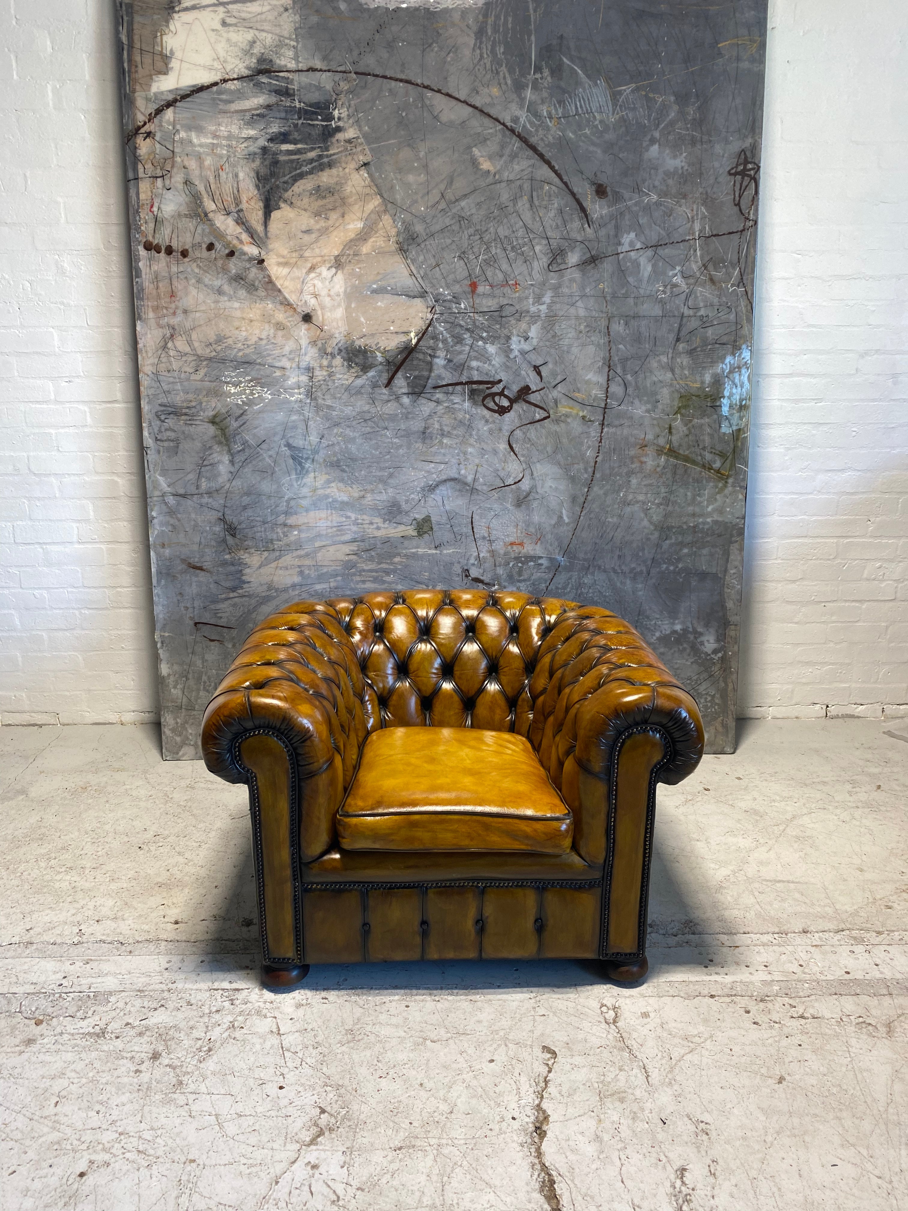 An amazing Matching Pair of Golden Tan MidC Chesterfield Club Chairs