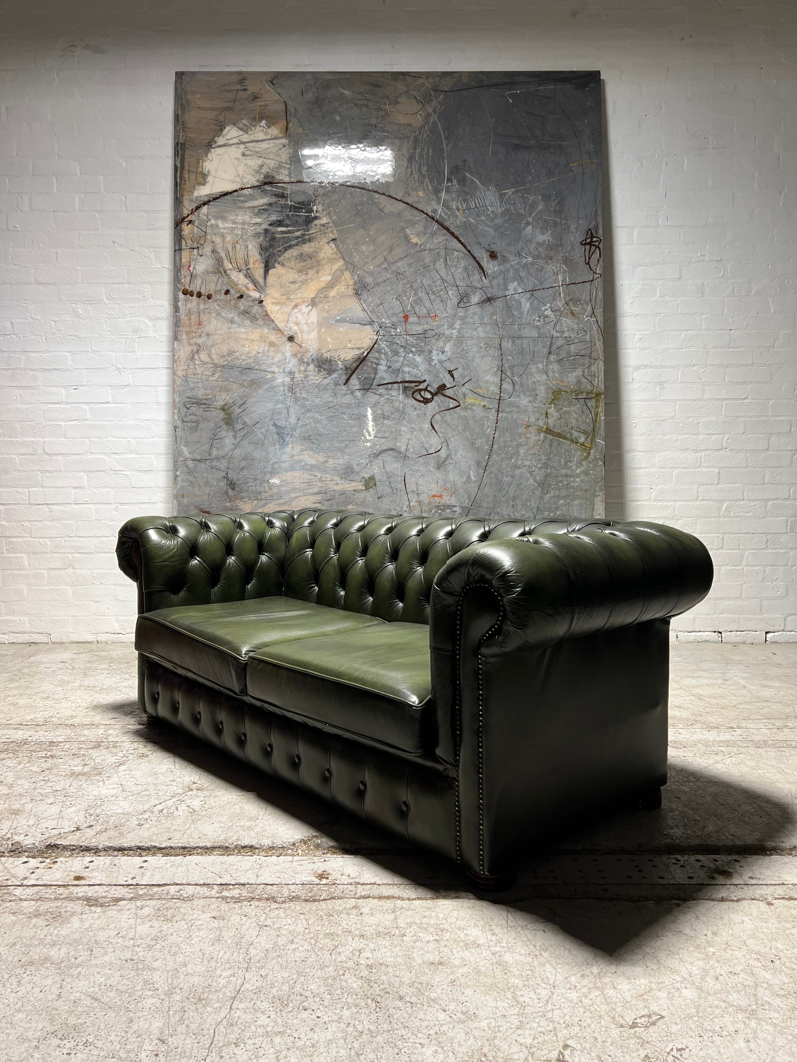 A Super Large 2 Seat Leather Chesterfield Sofa in Forest Green