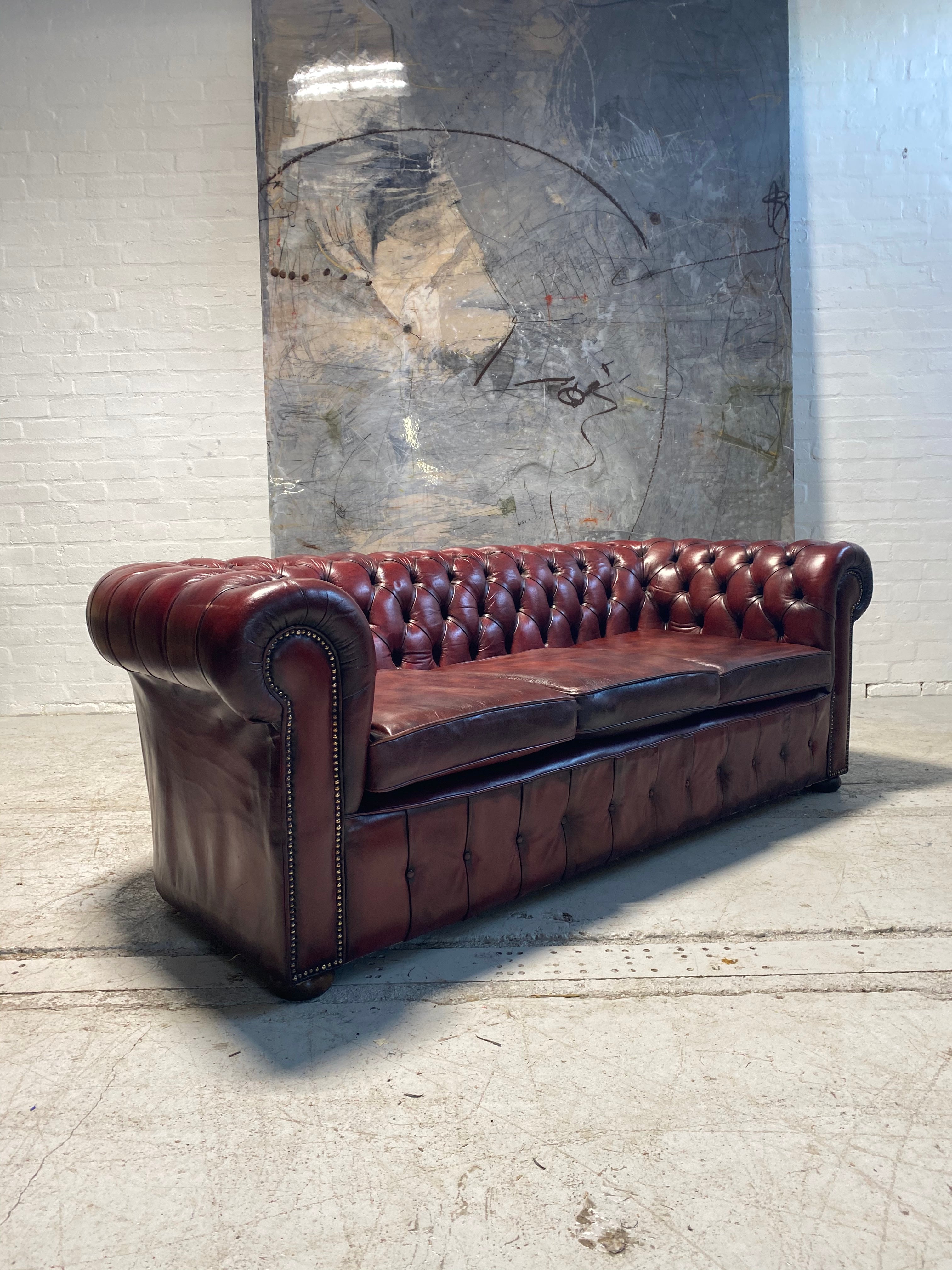 An Incredibly Rich Hand Dyed Vintage MidC Chesterfield Sofa