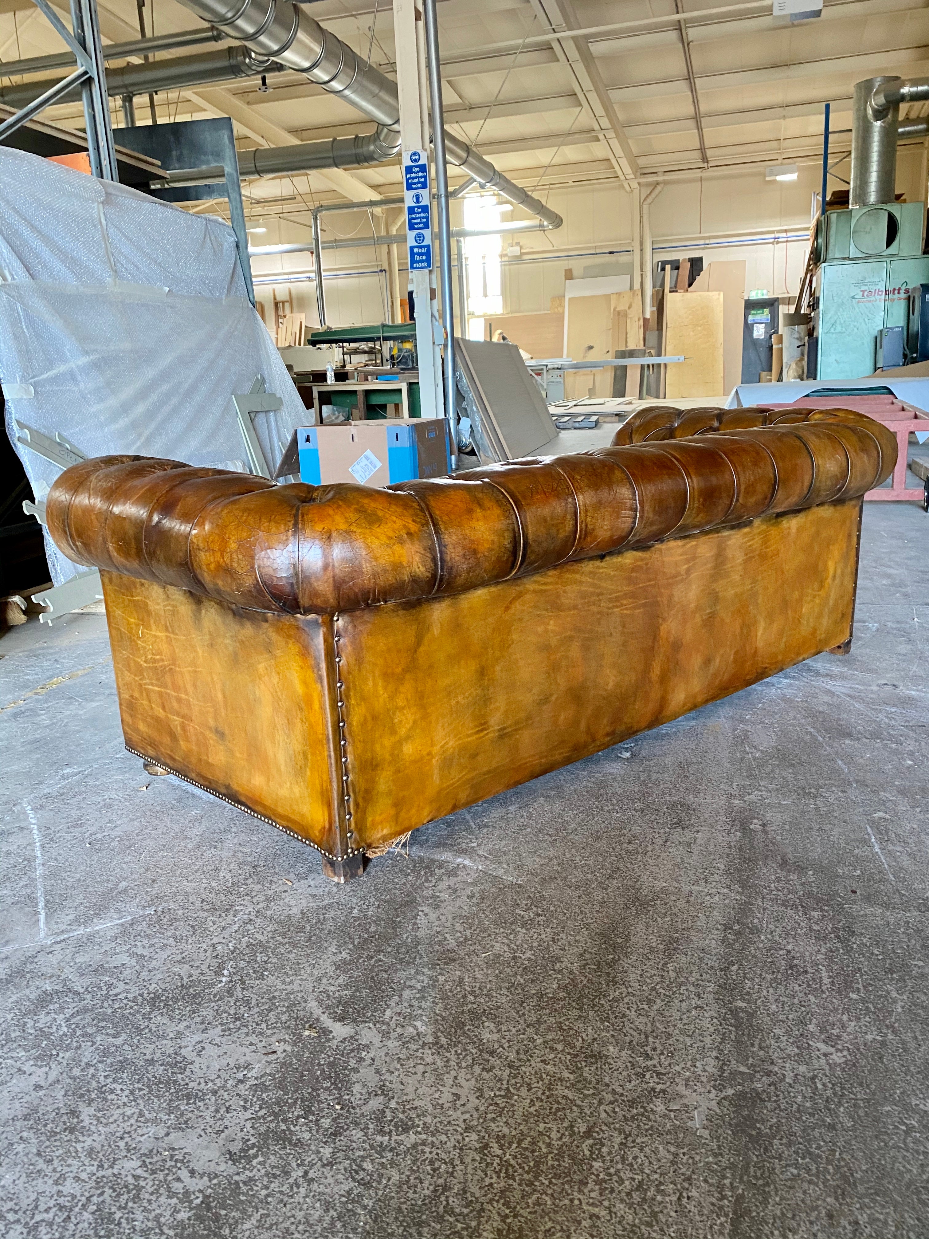 A Very Warm MidC Vintage Leather Chesterfield Sofa