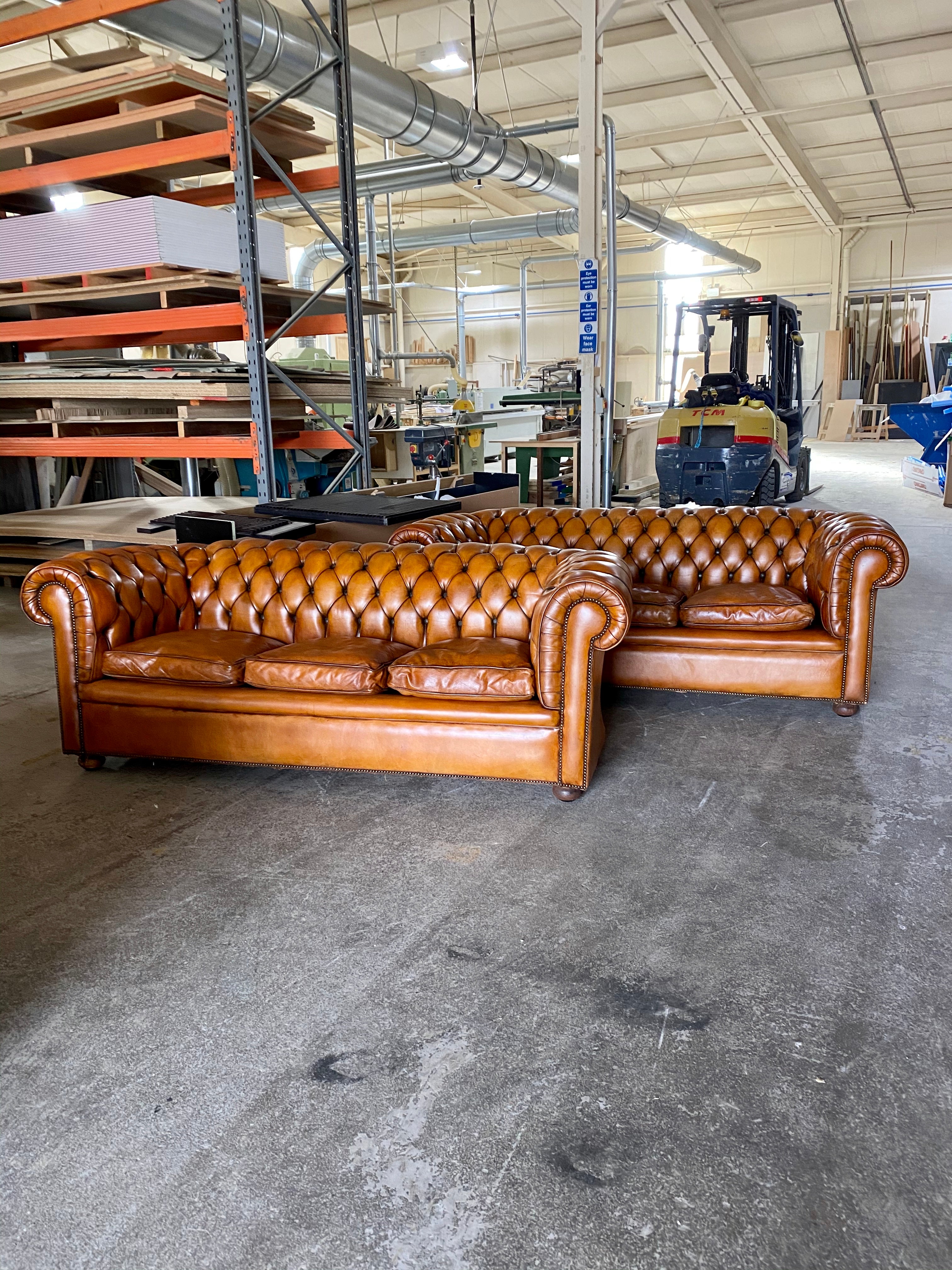 A Very Handsome Matching Pair of MidC Chesterfield Sofas