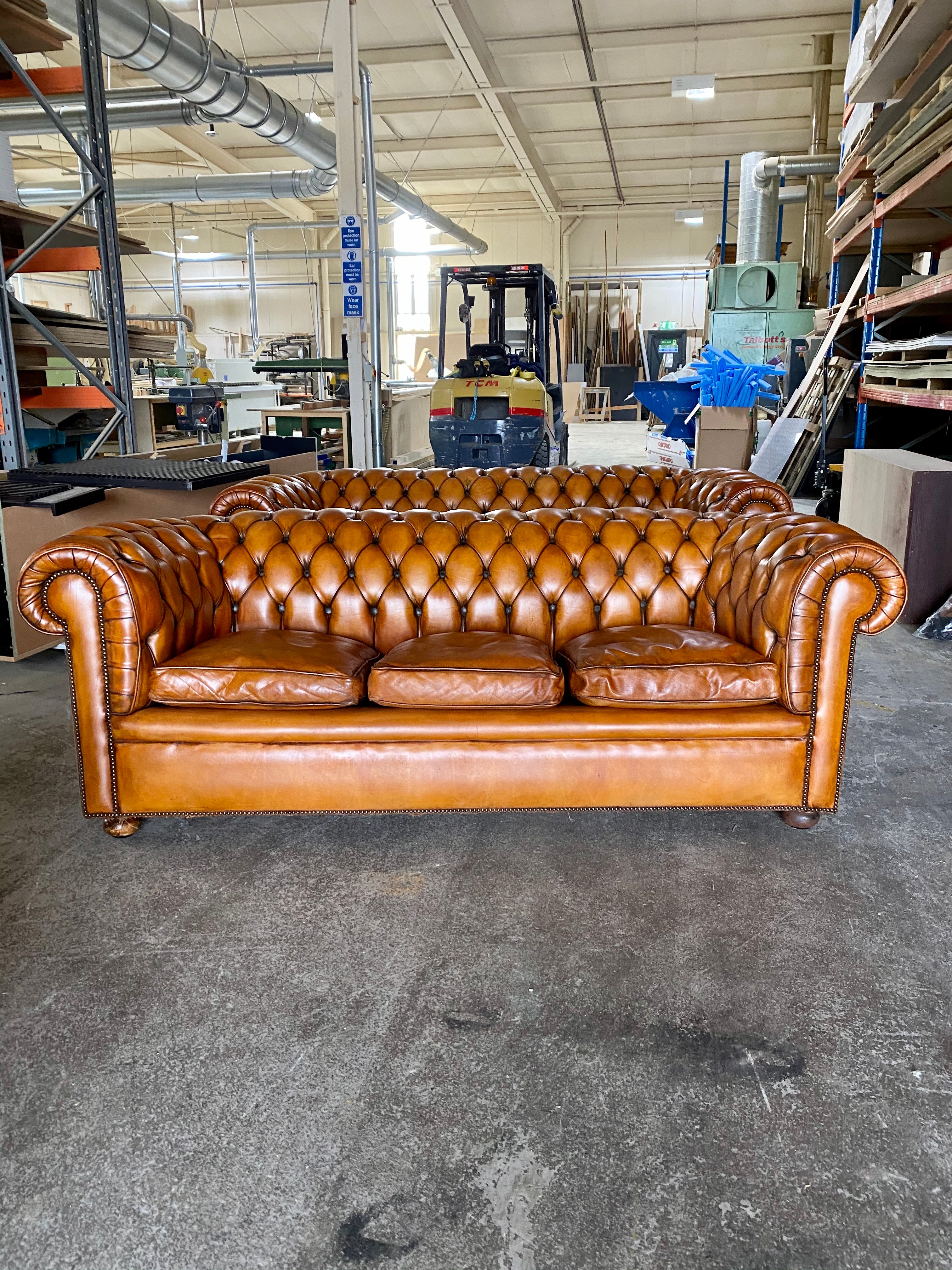 A Very Handsome Matching Pair of MidC Chesterfield Sofas