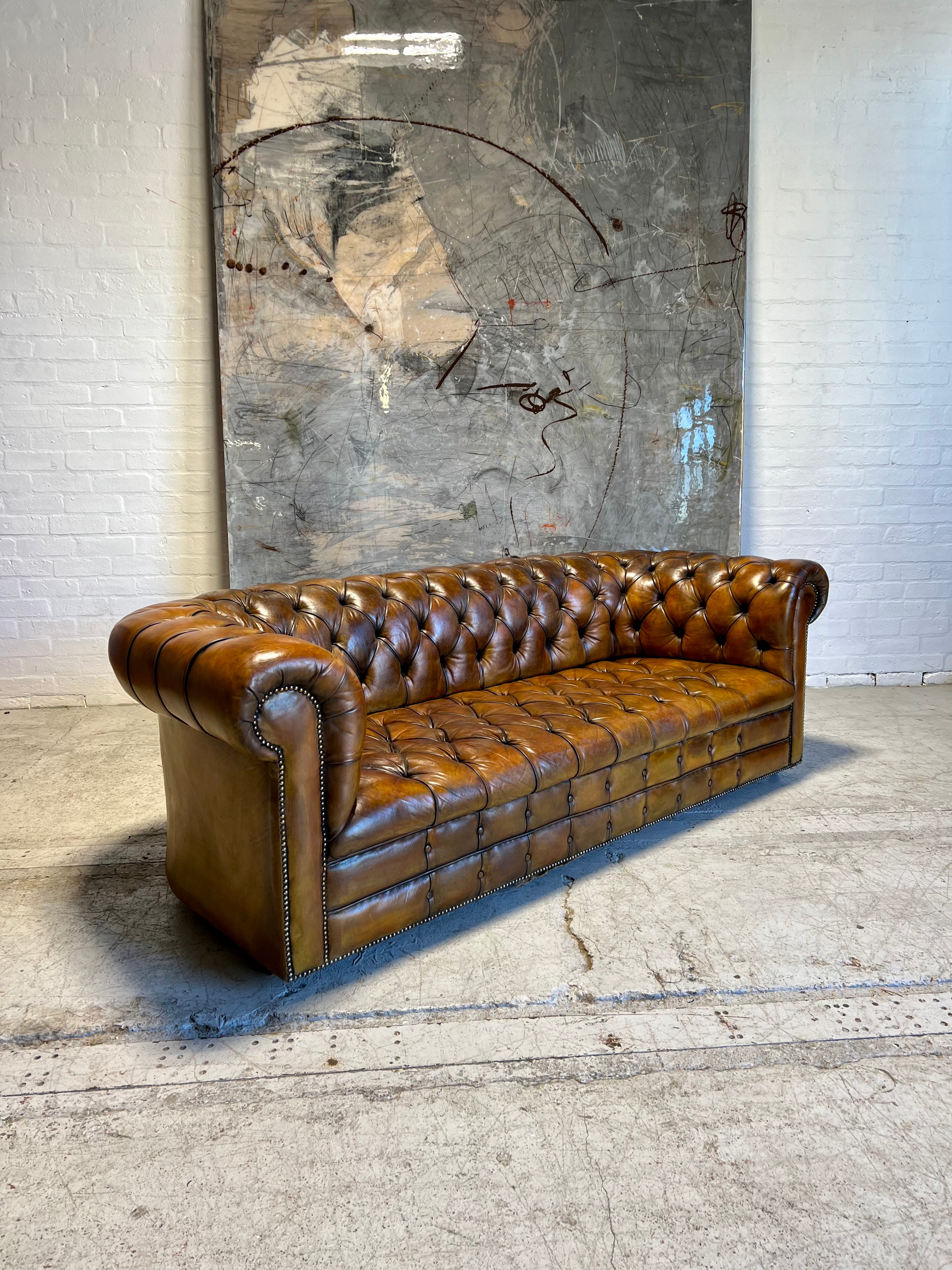 An Exceptional MidC Vintage Hand Dyed Leather Chesterfield Sofa (Matching Club Chairs Available)