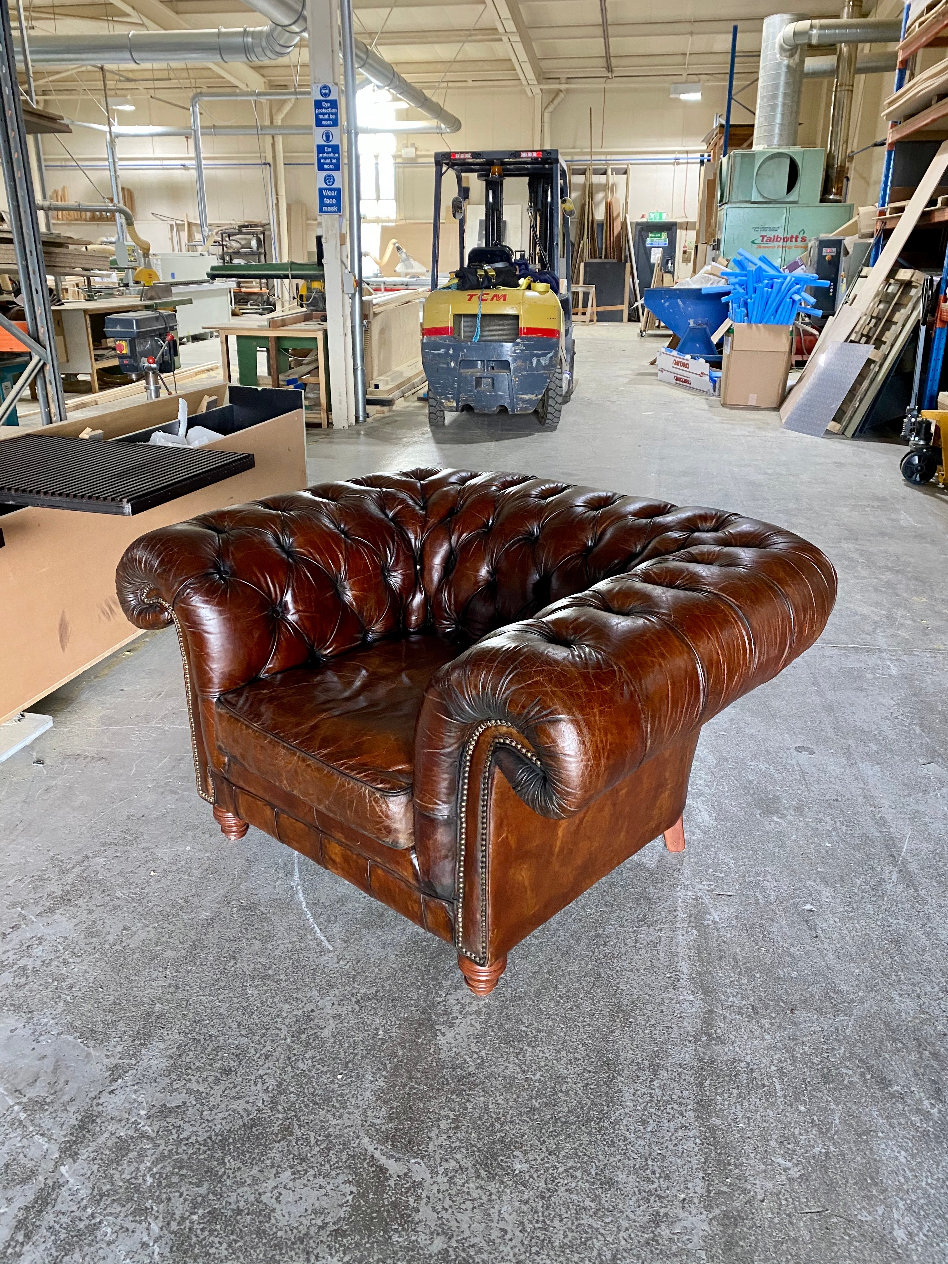 An Exceptionally Large Gentleman’s Club Chair in Hand Dyed Dark Walnut