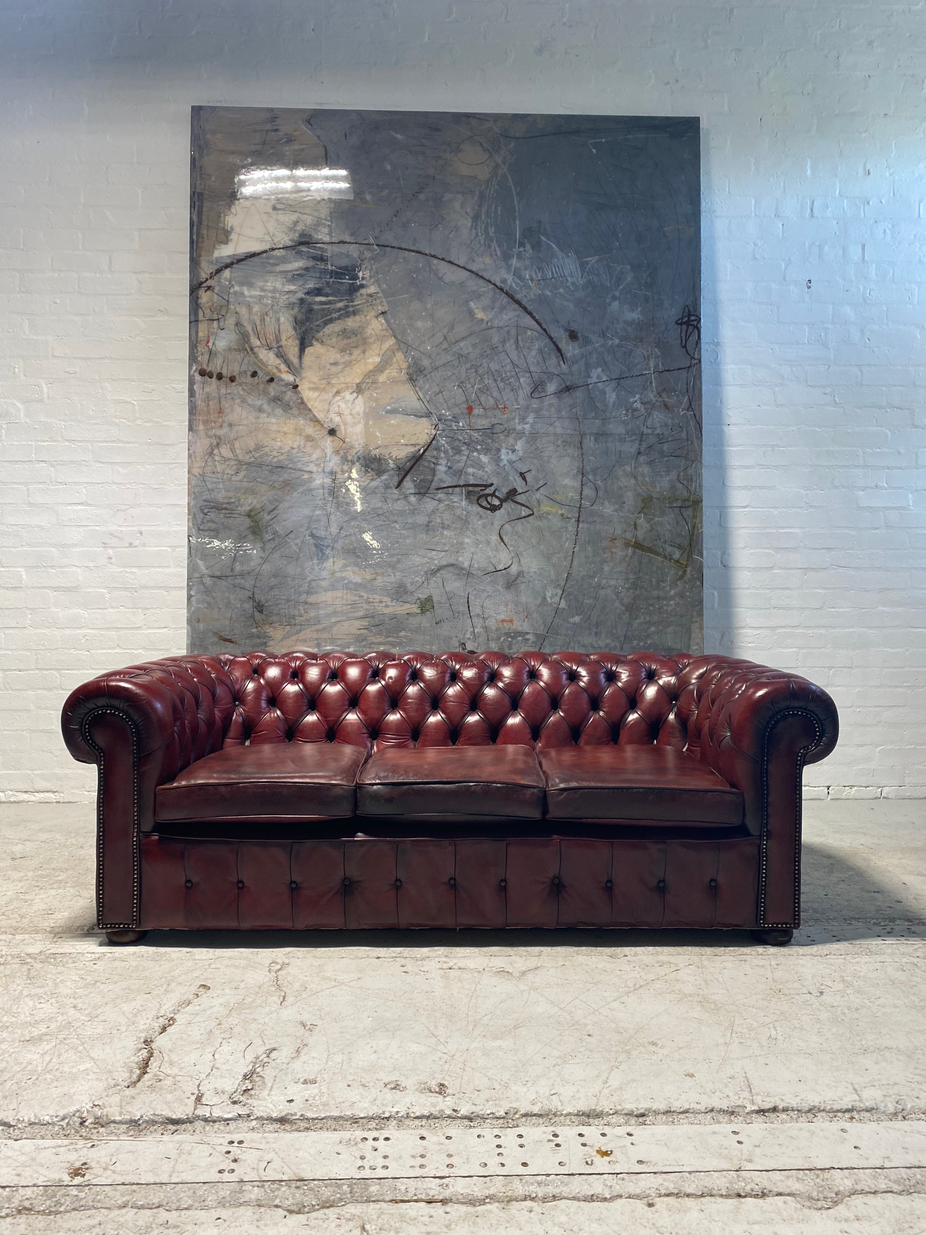 An Incredibly Rich Hand Dyed Vintage MidC Chesterfield Sofa