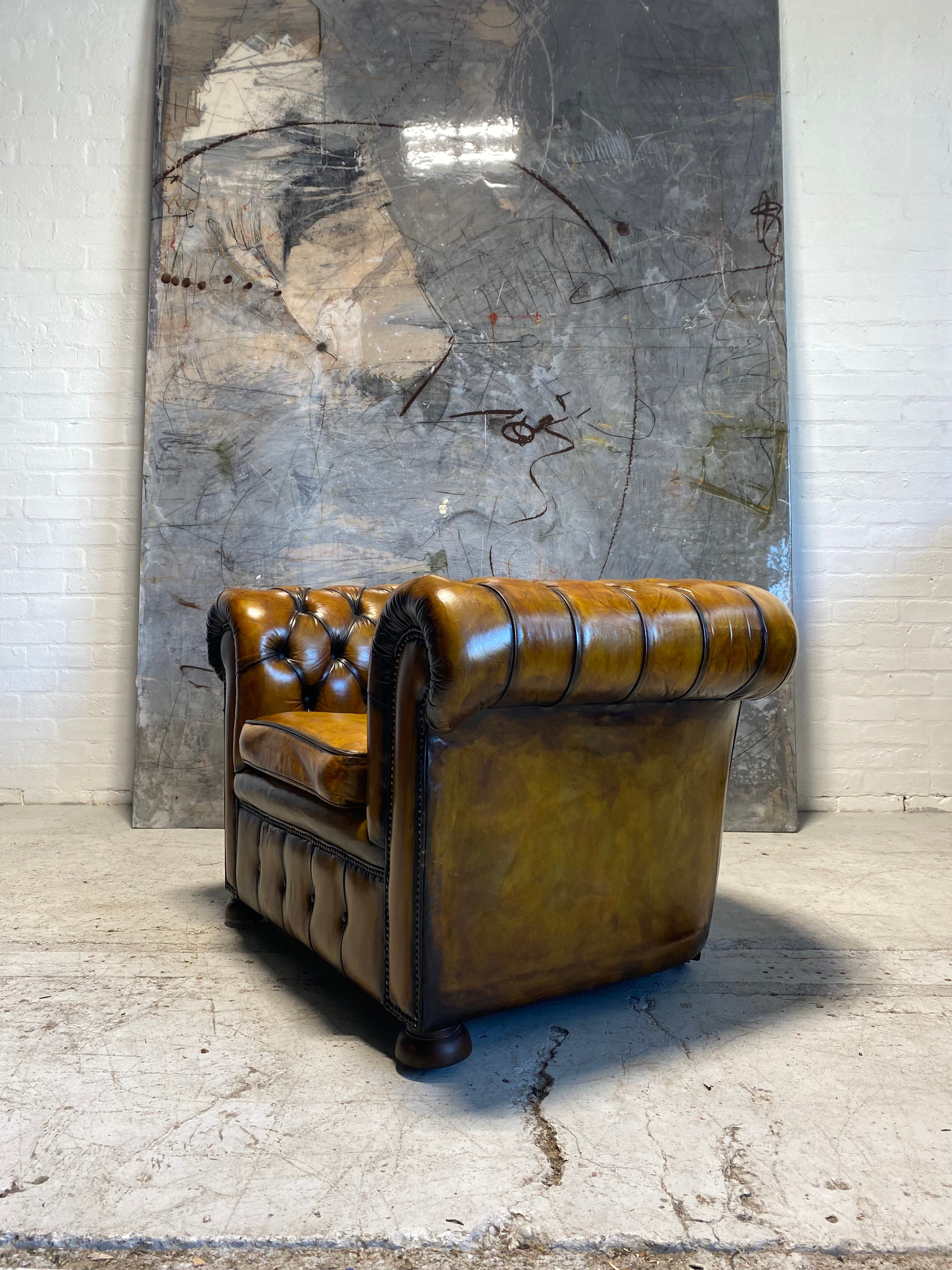 An amazing Matching Pair of Golden Tan MidC Chesterfield Club Chairs