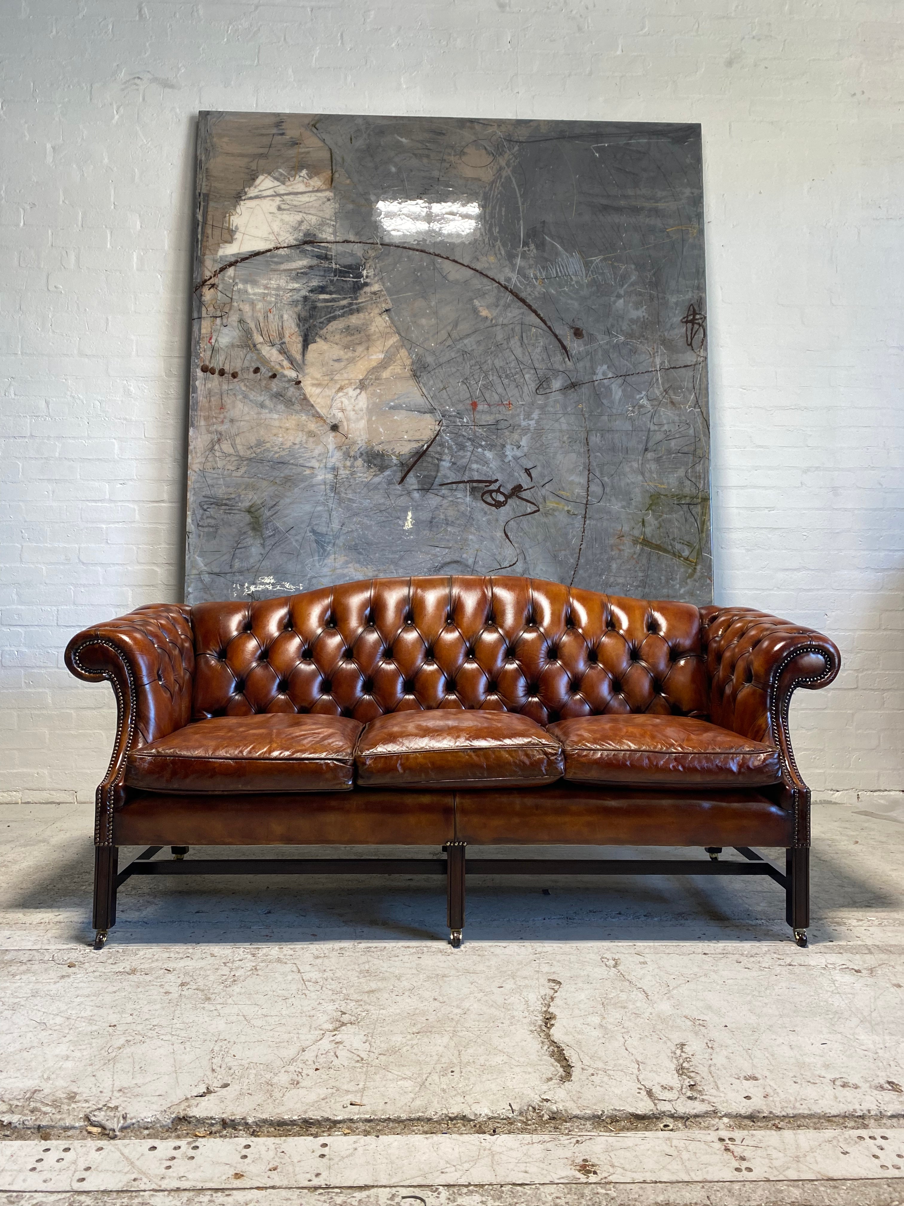 A Stunning MidC Chippendale Camel Back Hand Dyed Leather Sofa