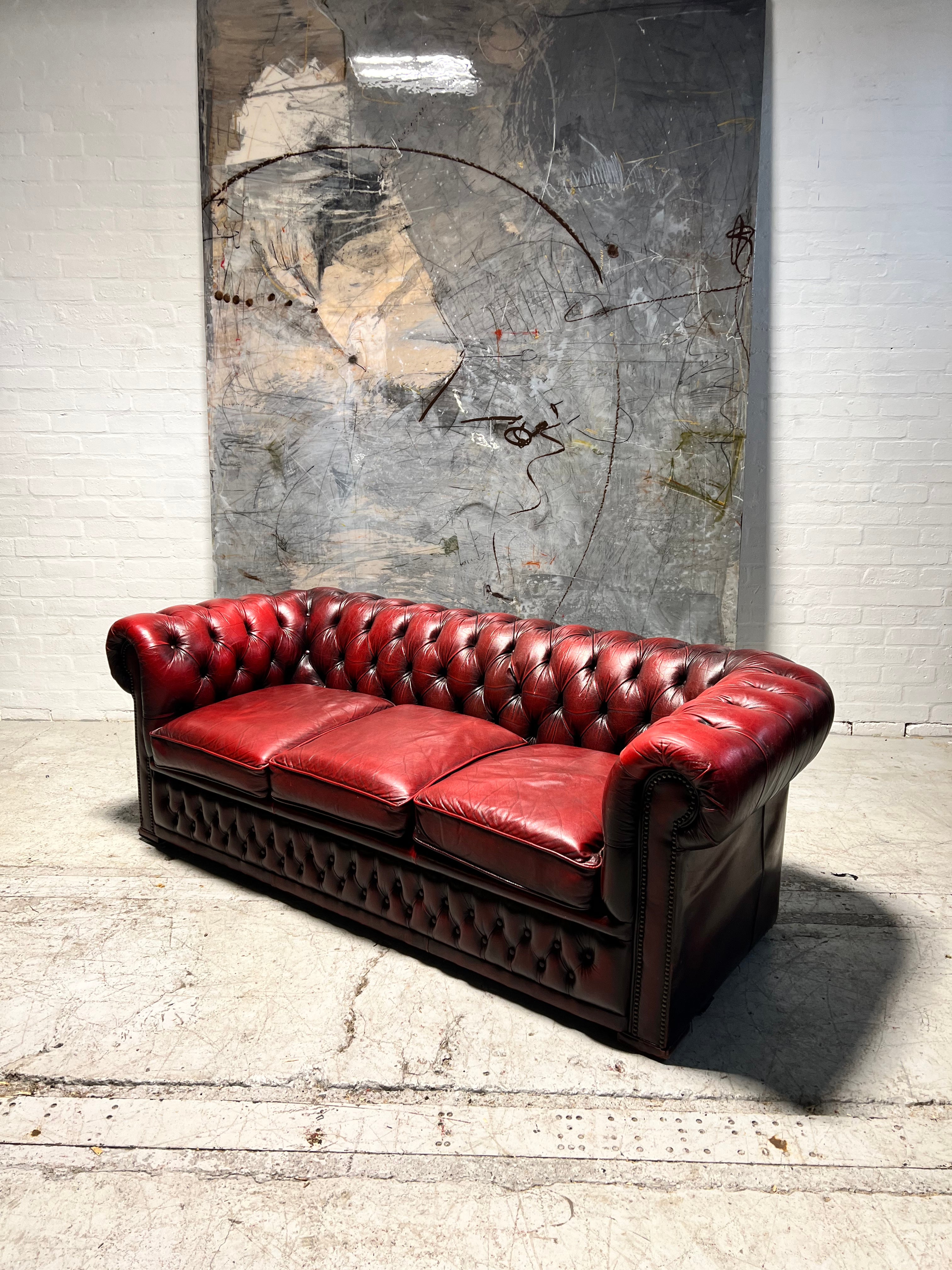 A Very Nice Leather Chesterfield 3 Seater Sofa in Reds