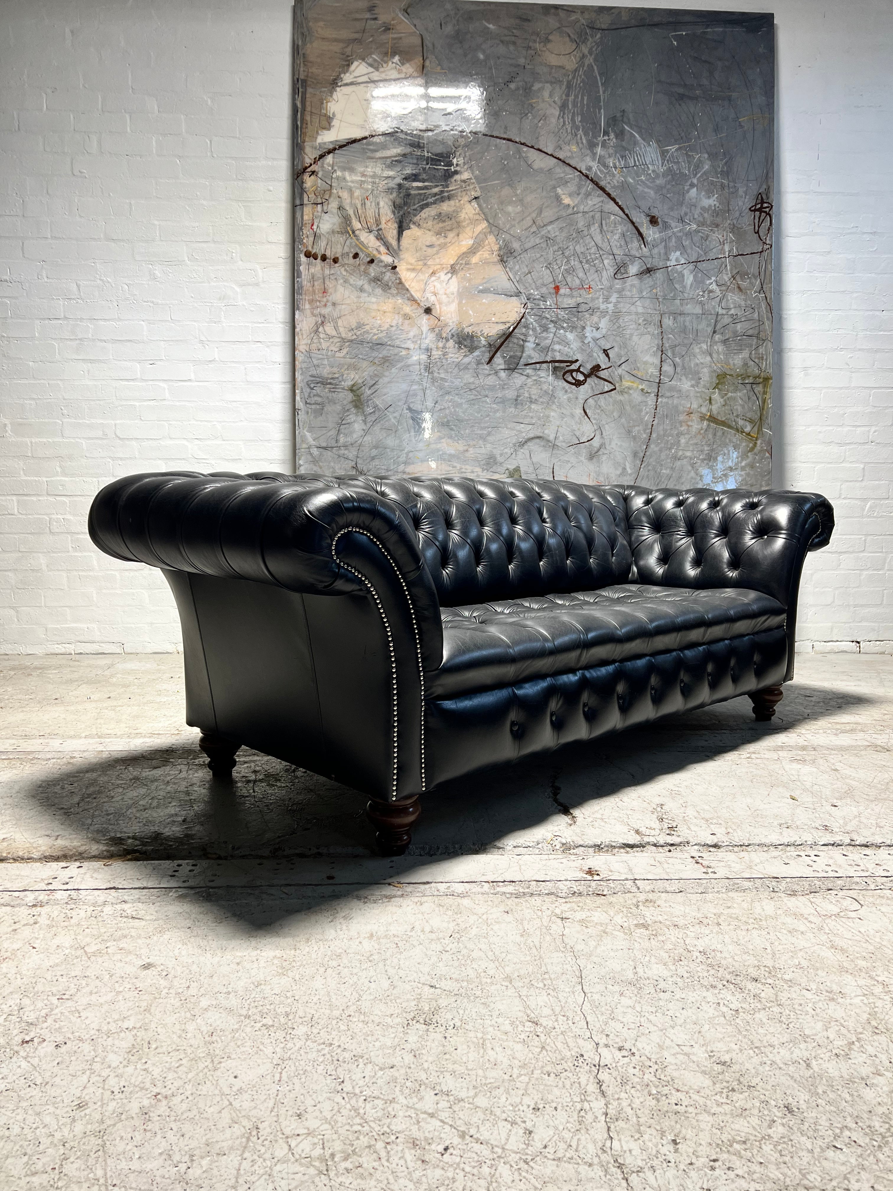 A Pair of Very Smart Black Leather Chesterfield Sofas