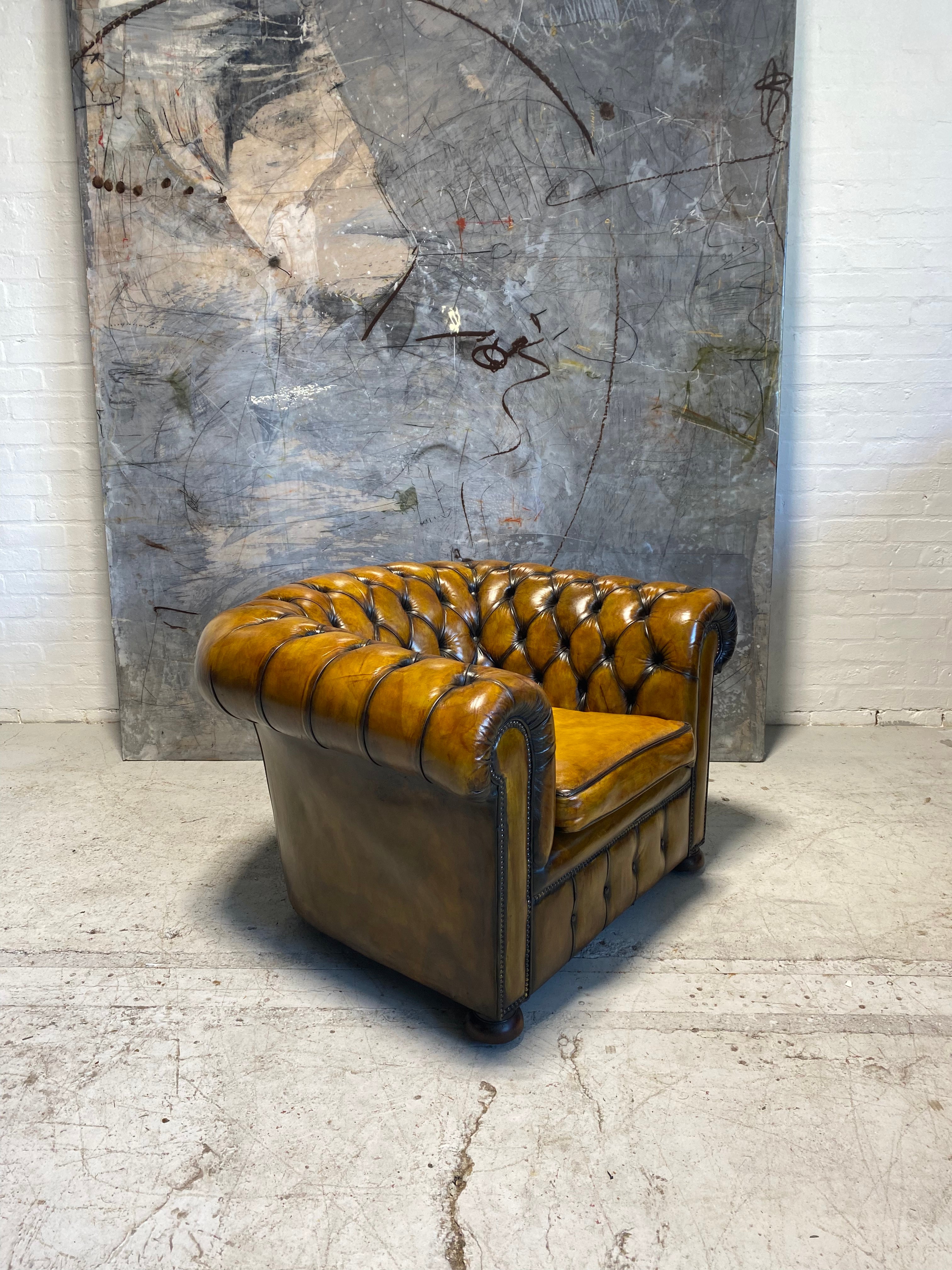 An amazing Matching Pair of Golden Tan MidC Chesterfield Club Chairs