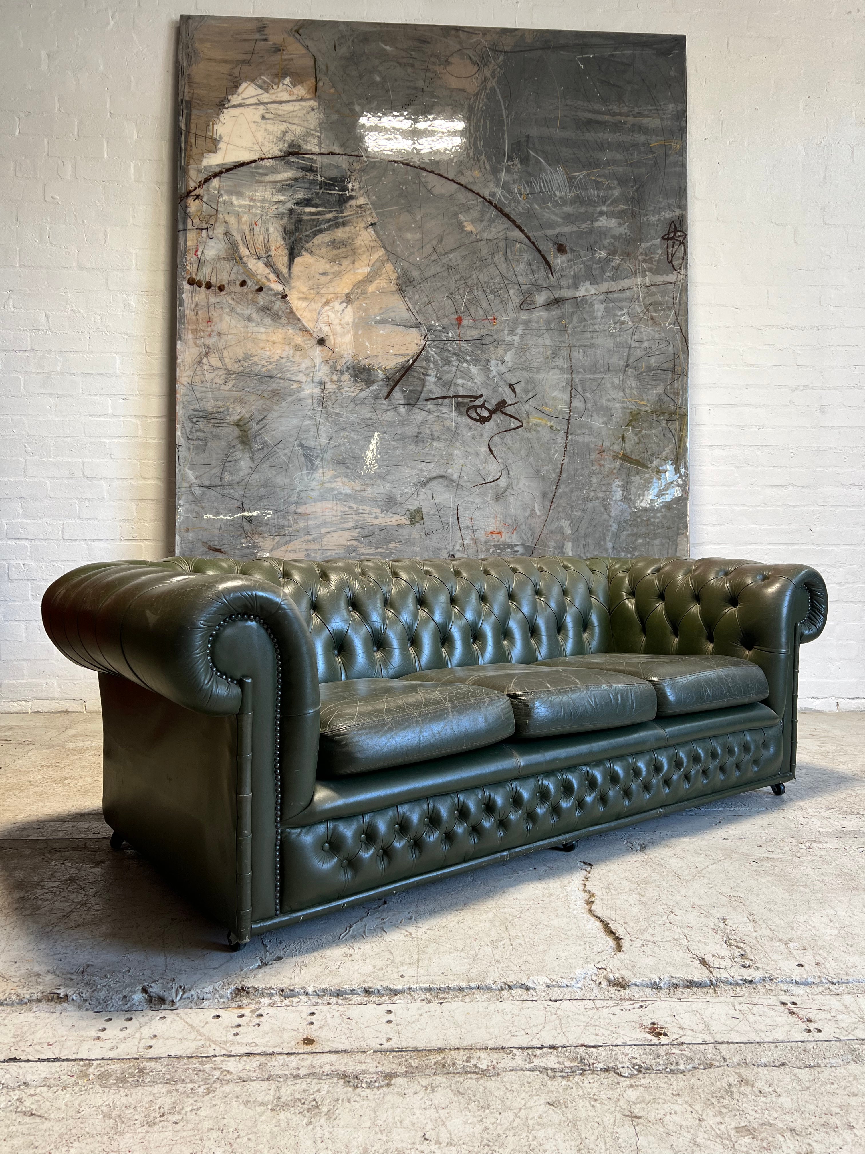 One of a Pair - a Very Smart Military Green Leather Chesterfield Sofa