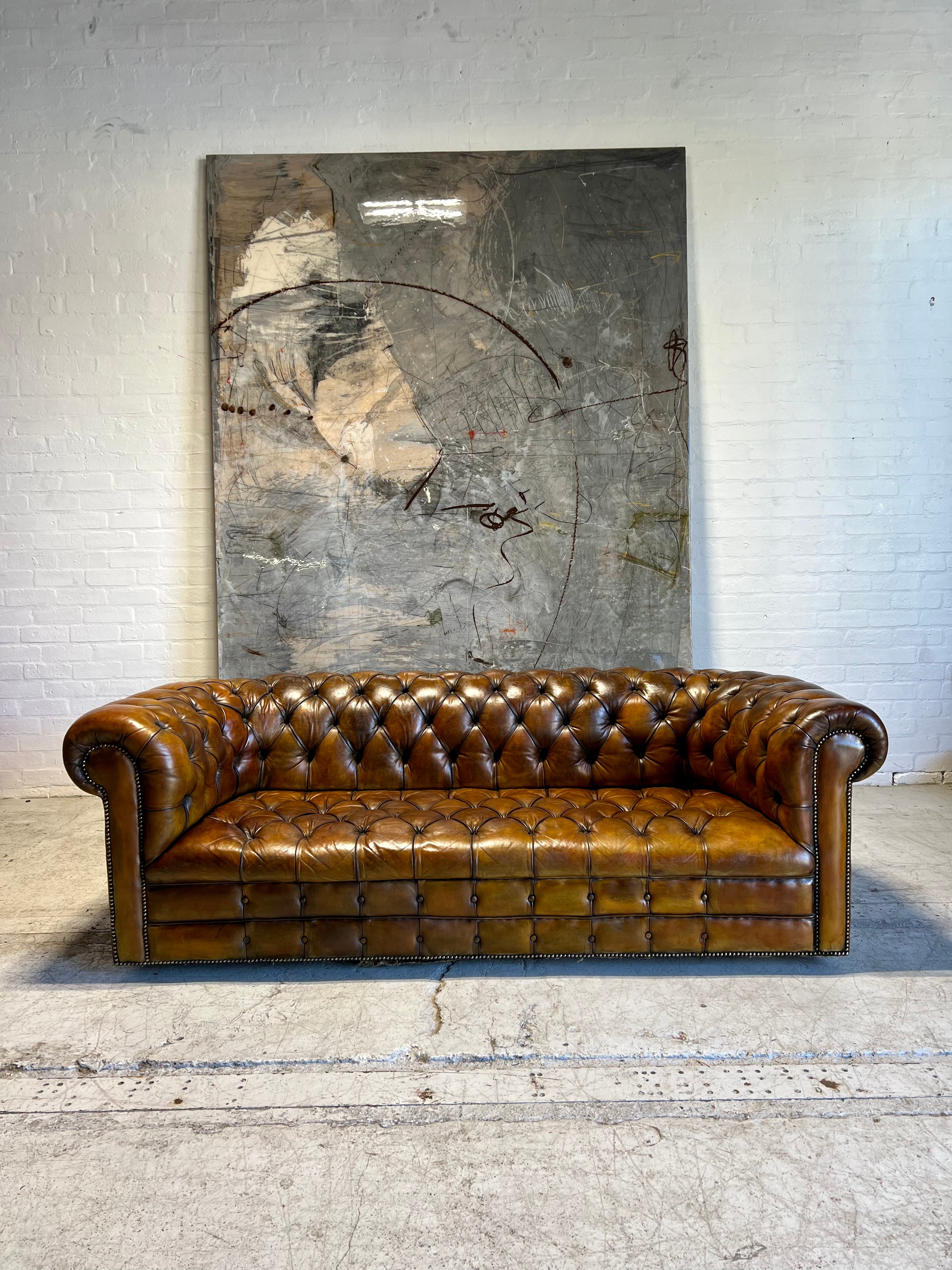 An Exceptional MidC Vintage Hand Dyed Leather Chesterfield Sofa (Matching Club Chairs Available)