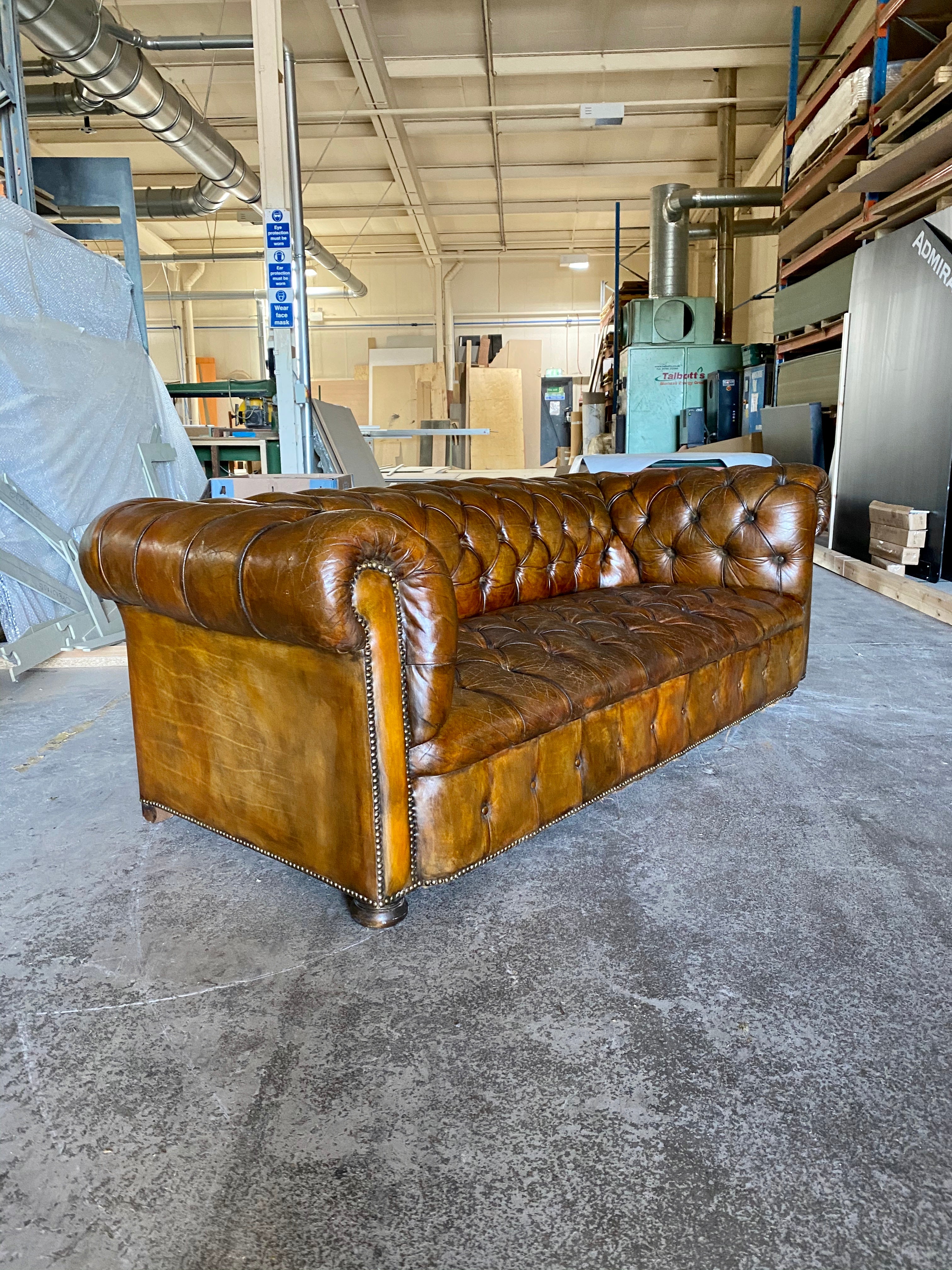 A Very Warm MidC Vintage Leather Chesterfield Sofa