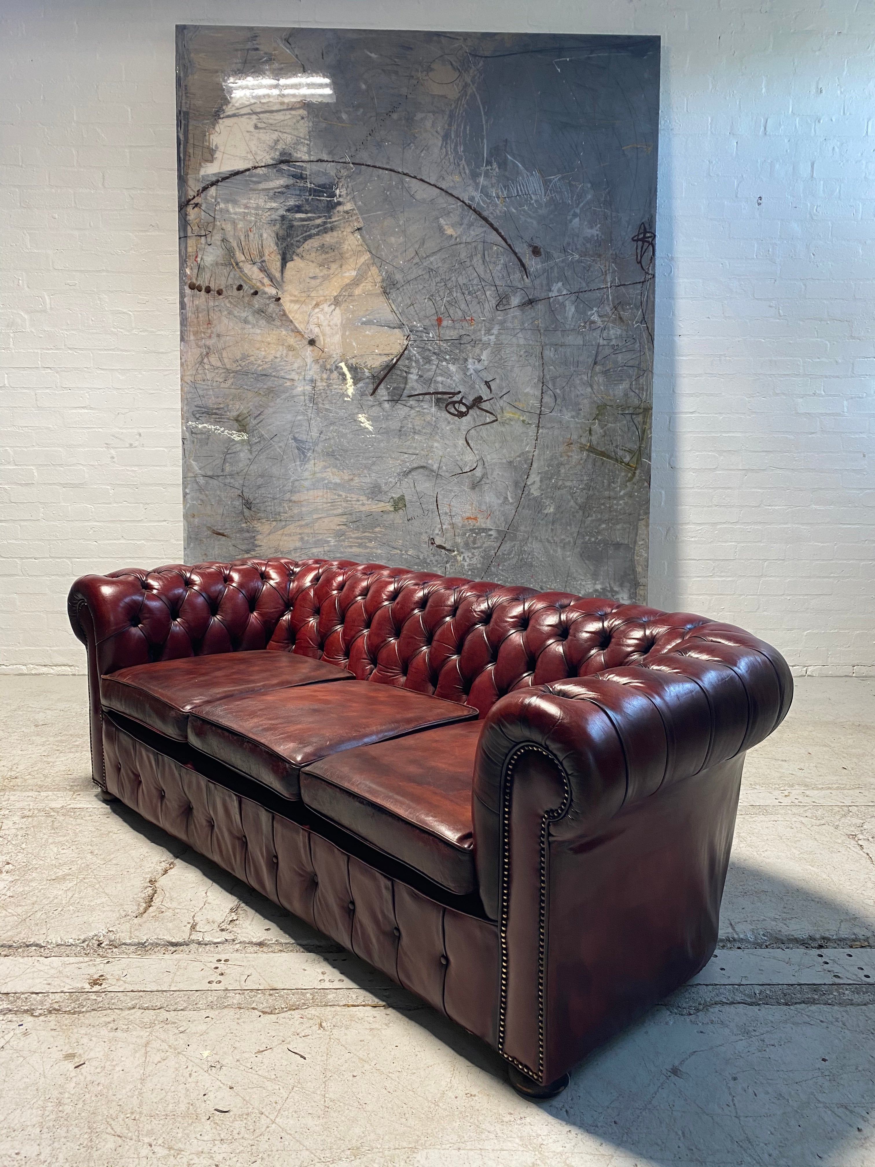 An Incredibly Rich Hand Dyed Vintage MidC Chesterfield Sofa