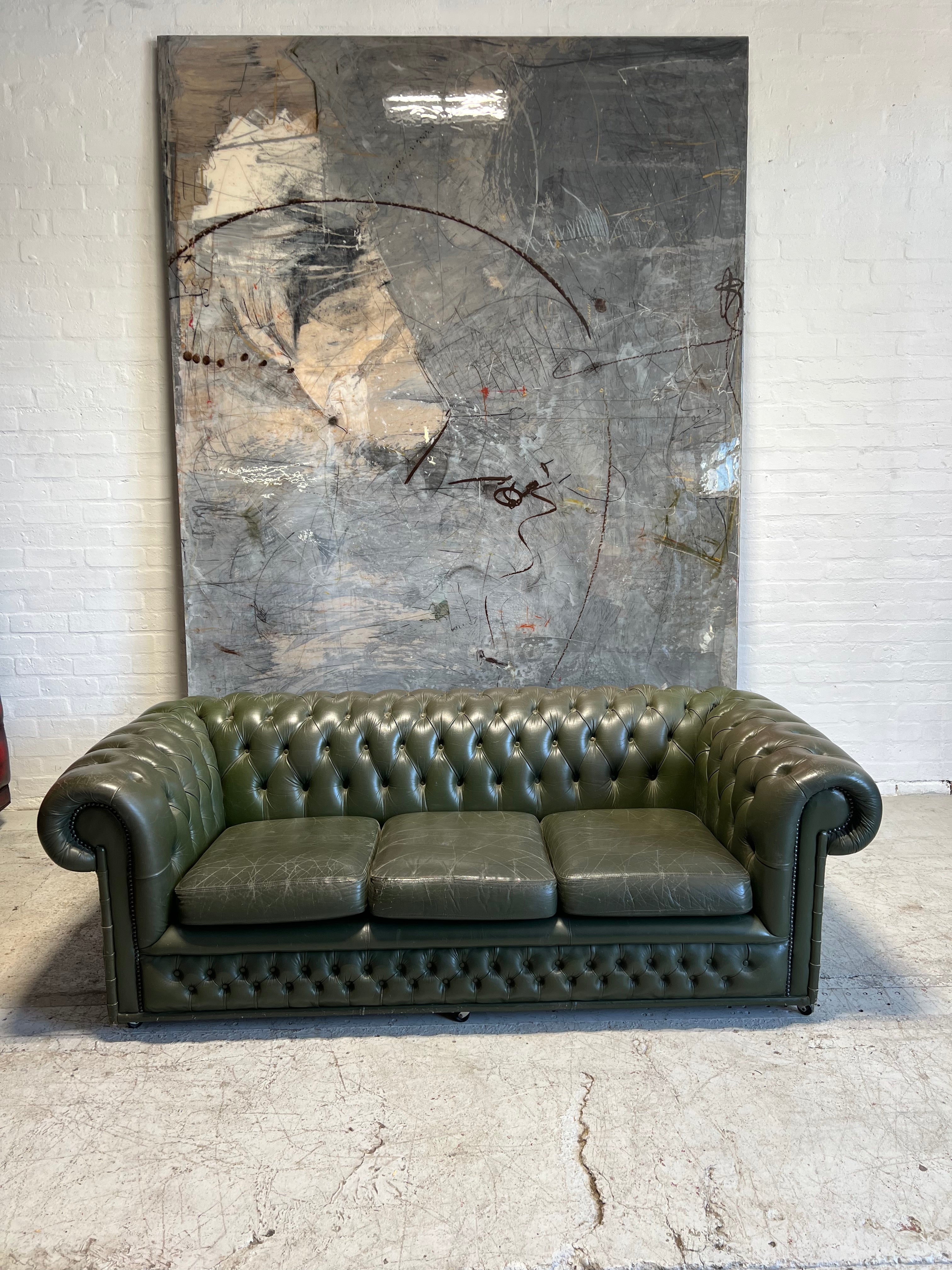 One of a Pair - a Very Smart Military Green Leather Chesterfield Sofa