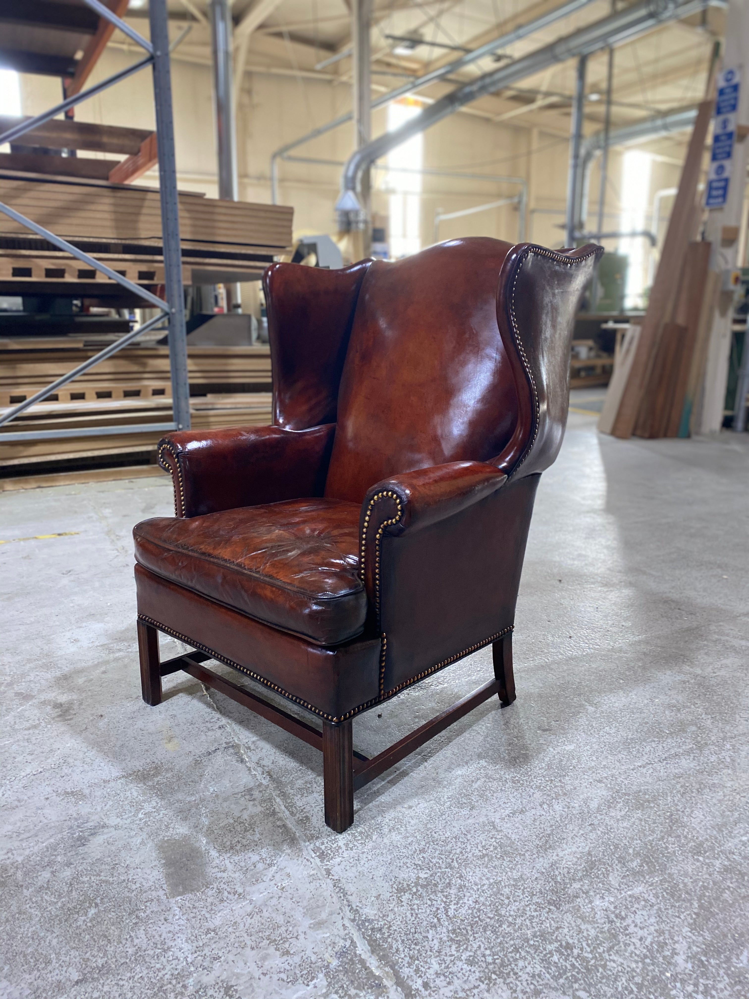 A Beautiful Early 20thC Gentleman’s Wing chair in Horse Chestnut