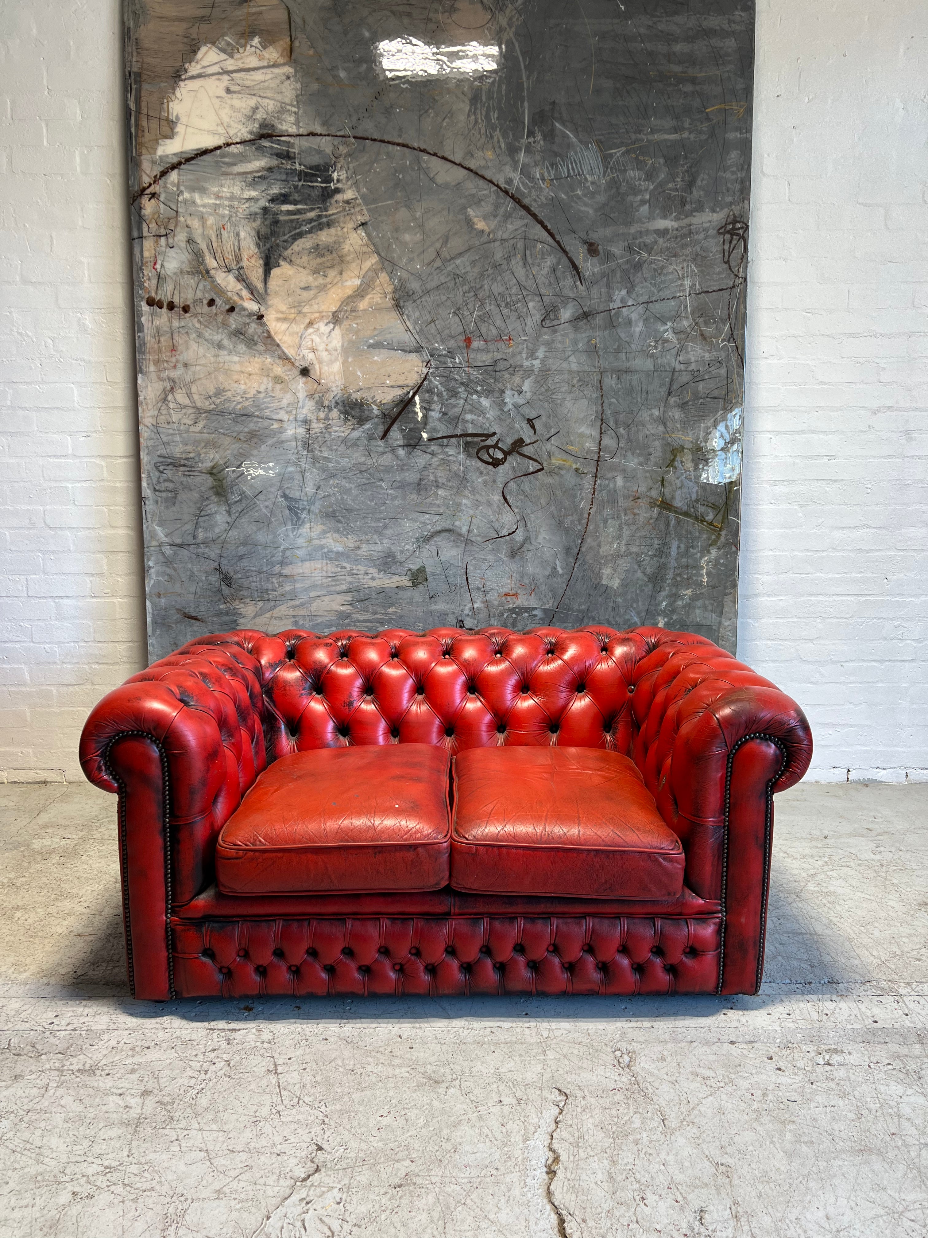 A Lovely Little 2 Seater Leather Chesterfield Sofa in Red