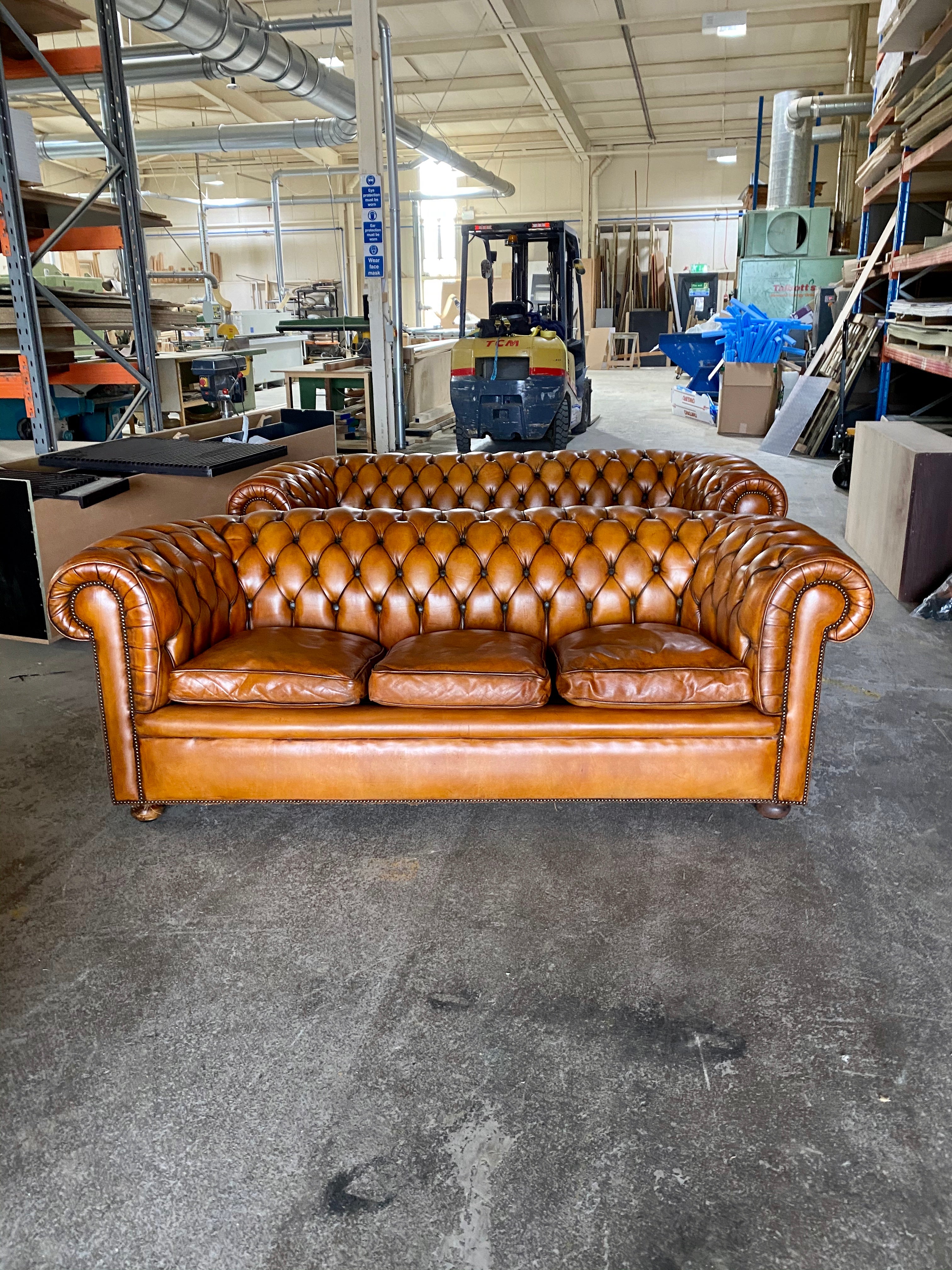 A Very Handsome Matching Pair of MidC Chesterfield Sofas