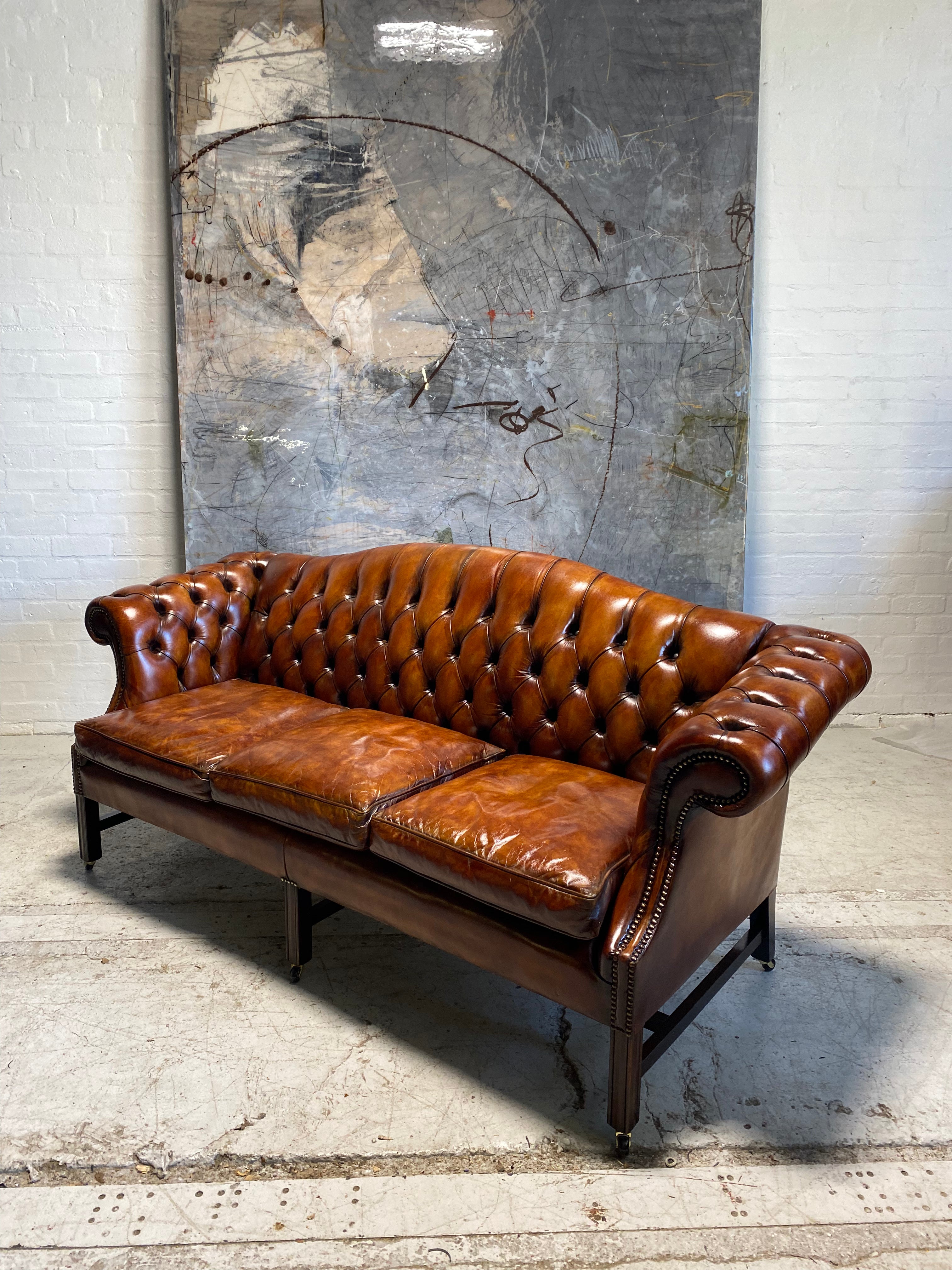 A Stunning MidC Chippendale Camel Back Hand Dyed Leather Sofa