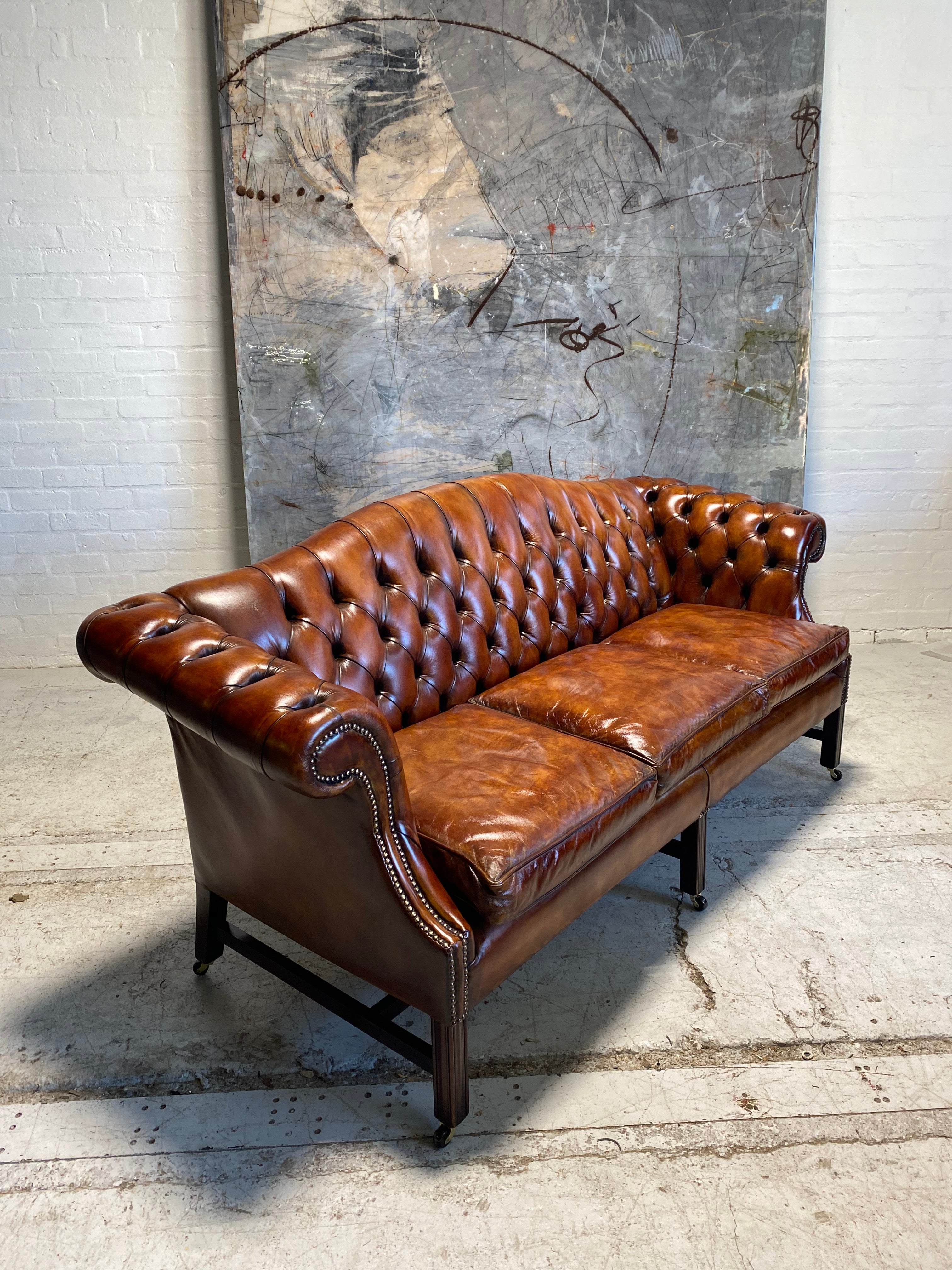 A Stunning MidC Chippendale Camel Back Hand Dyed Leather Sofa