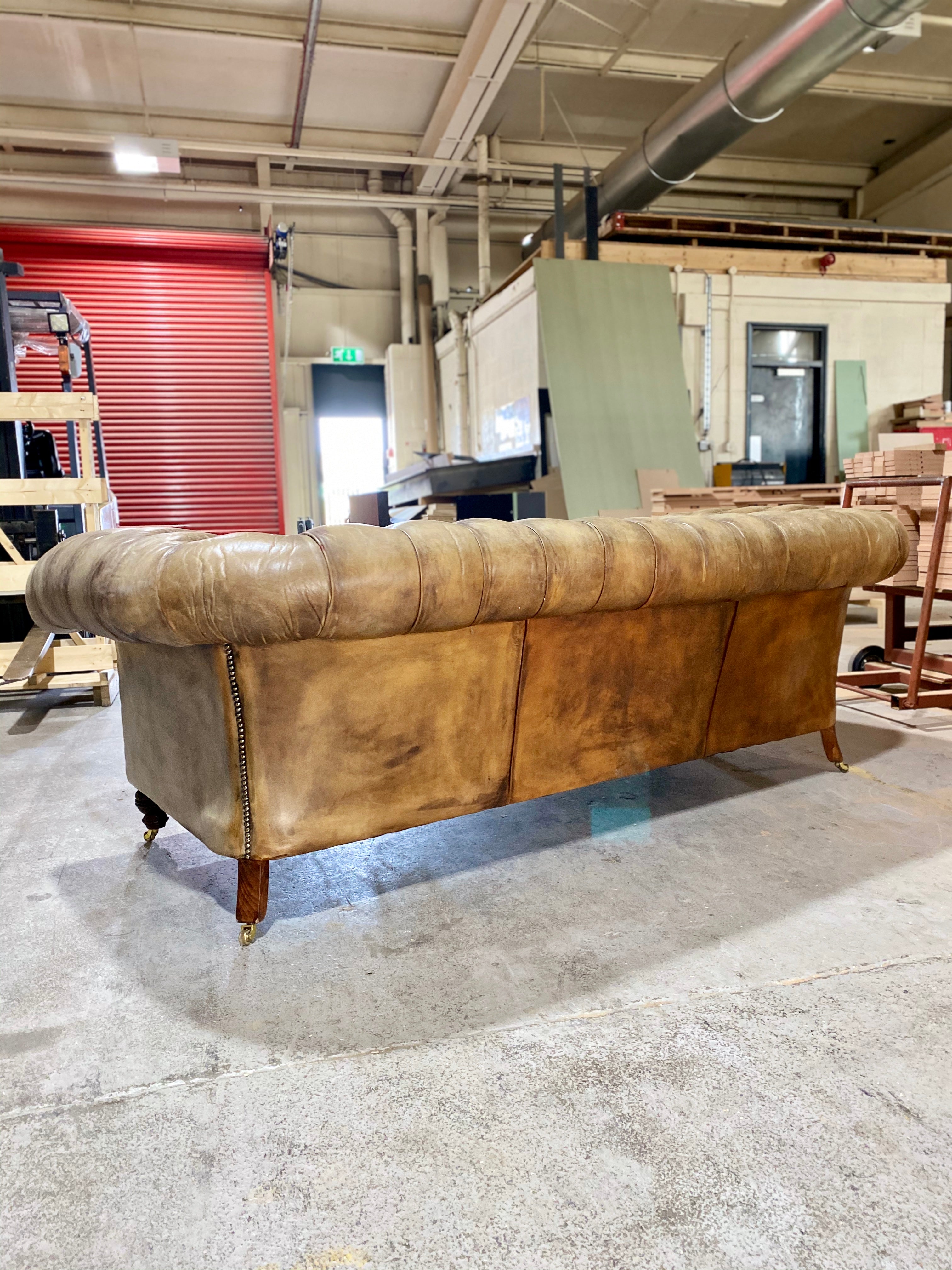 A very Smart 20thC Chesterfield Sofa in very Well Patinated Hand Dyed Leathers