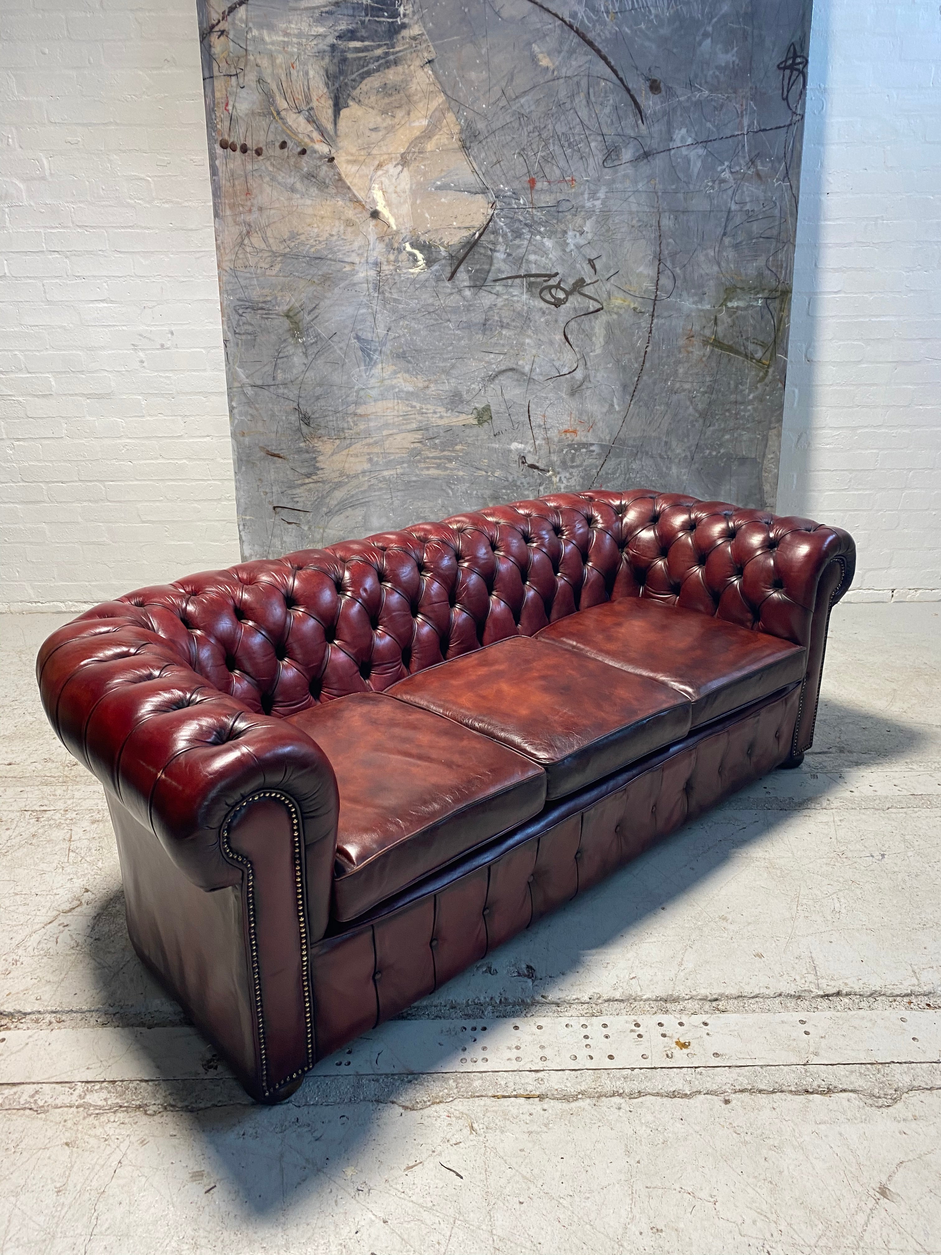 An Incredibly Rich Hand Dyed Vintage MidC Chesterfield Sofa