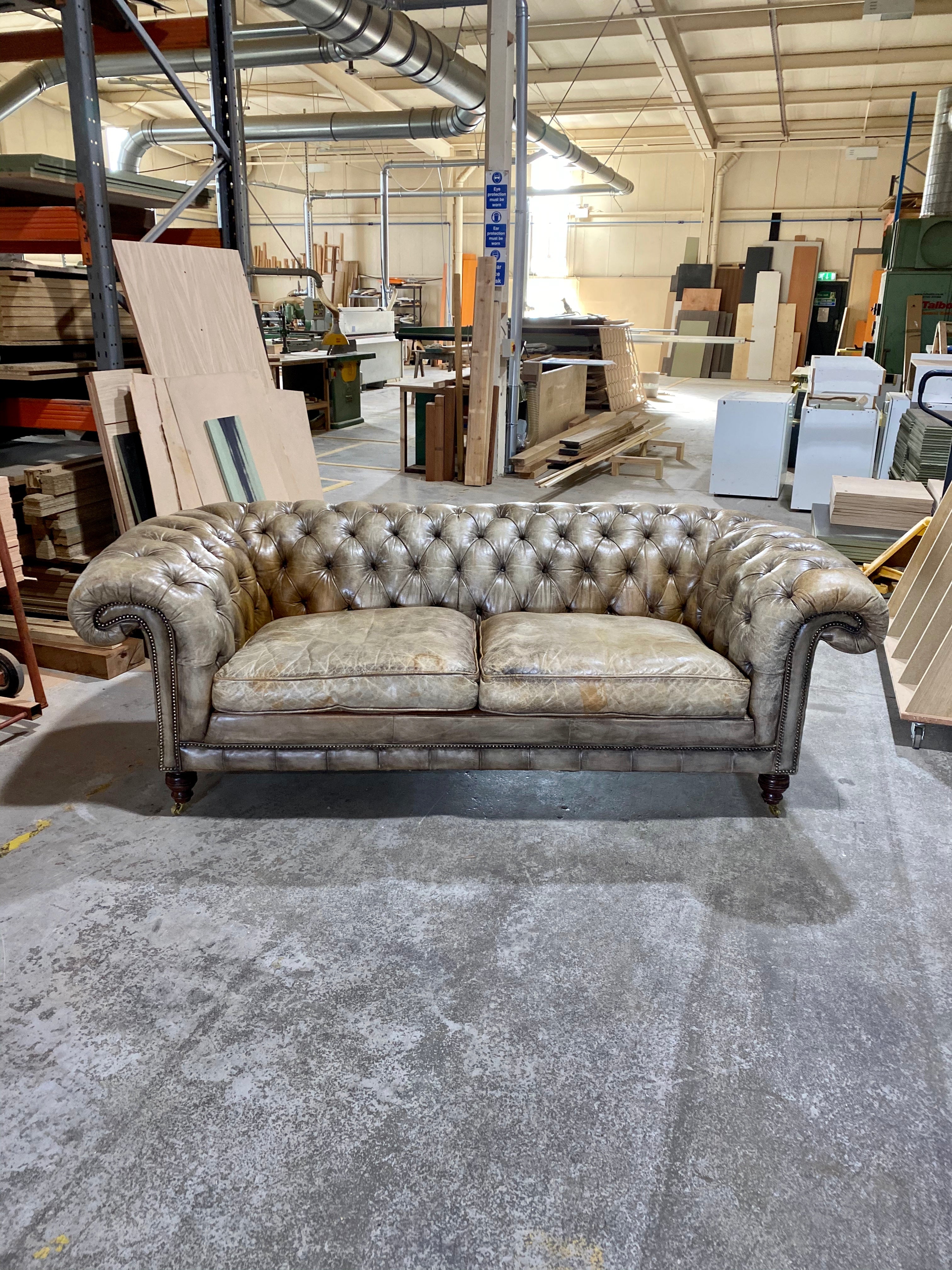 A very Smart 20thC Chesterfield Sofa in very Well Patinated Hand Dyed Leathers