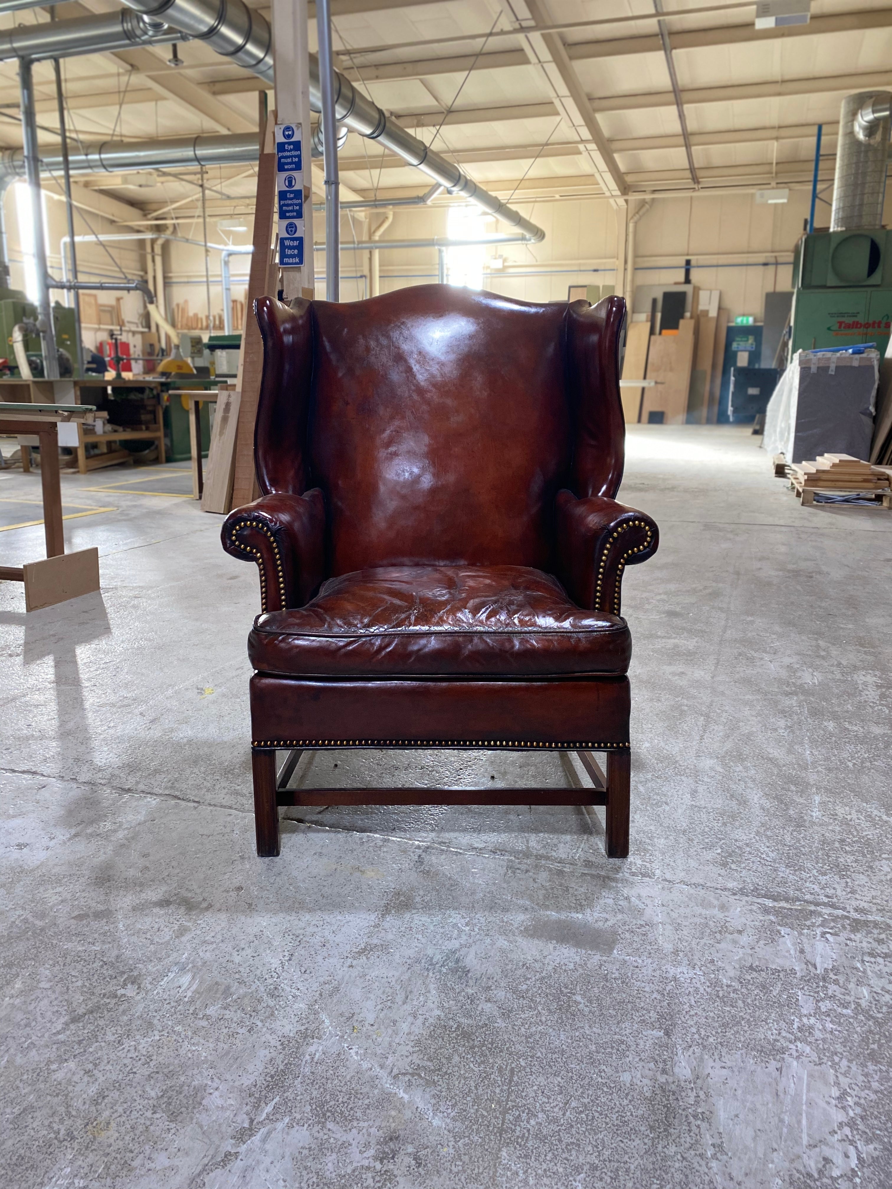 A Beautiful Early 20thC Gentleman’s Wing chair in Horse Chestnut