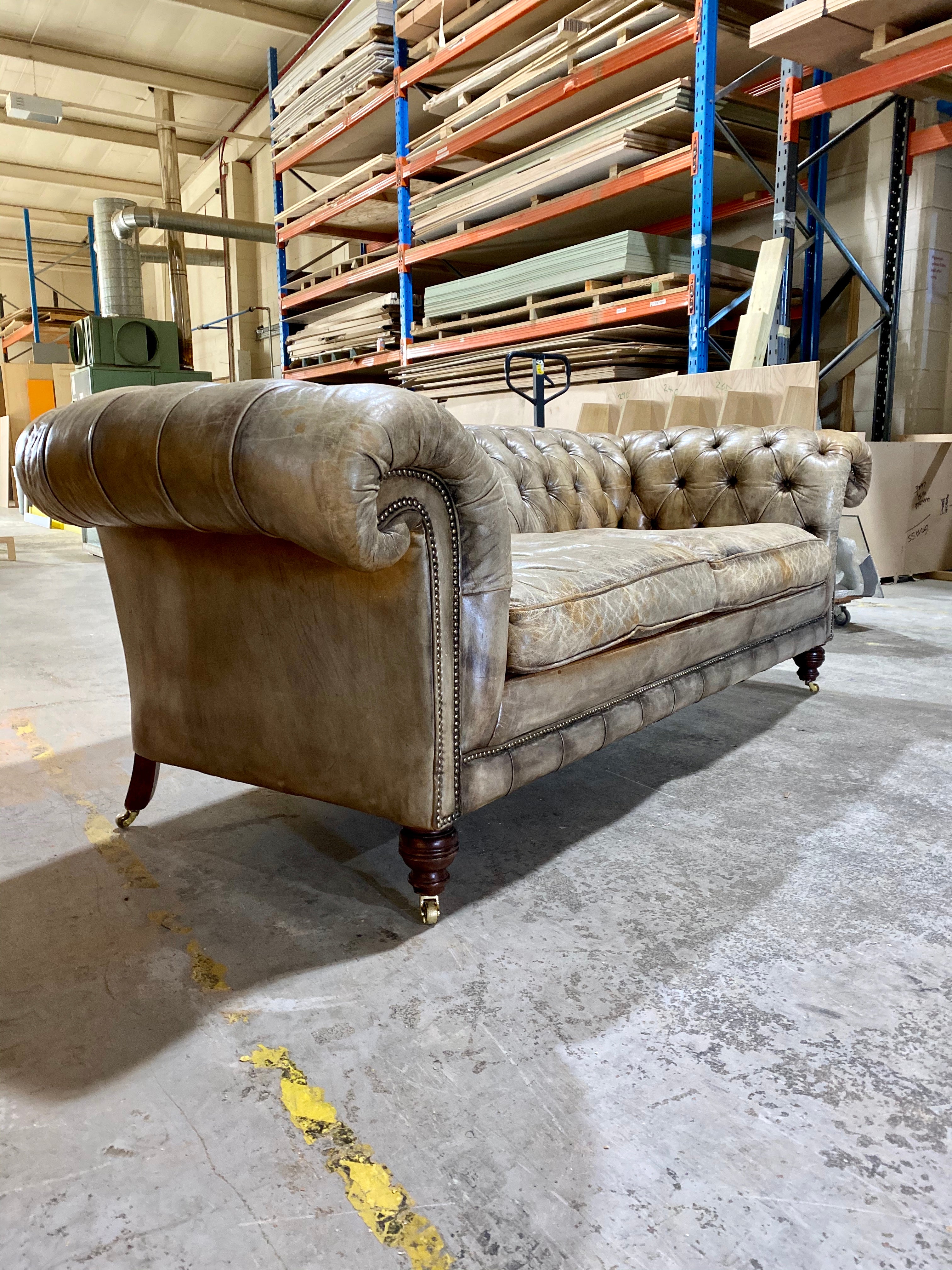 A very Smart 20thC Chesterfield Sofa in very Well Patinated Hand Dyed Leathers