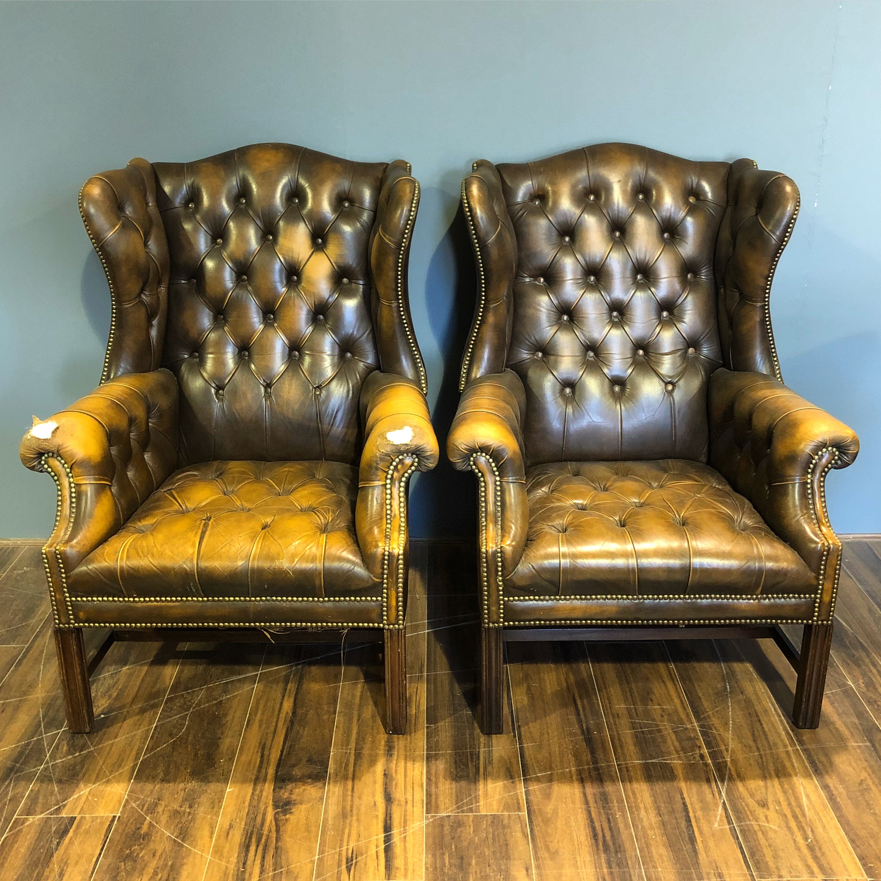 A Super Matching Pair of Vintage Leather Chesterfield Wing Back Chairs