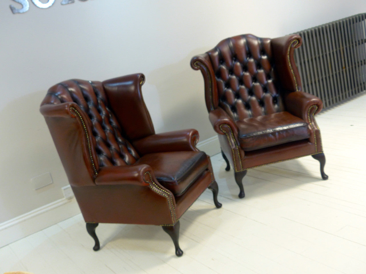 PAIR OF BROWN WING BACK CHAIRS : TO BE RESTORED