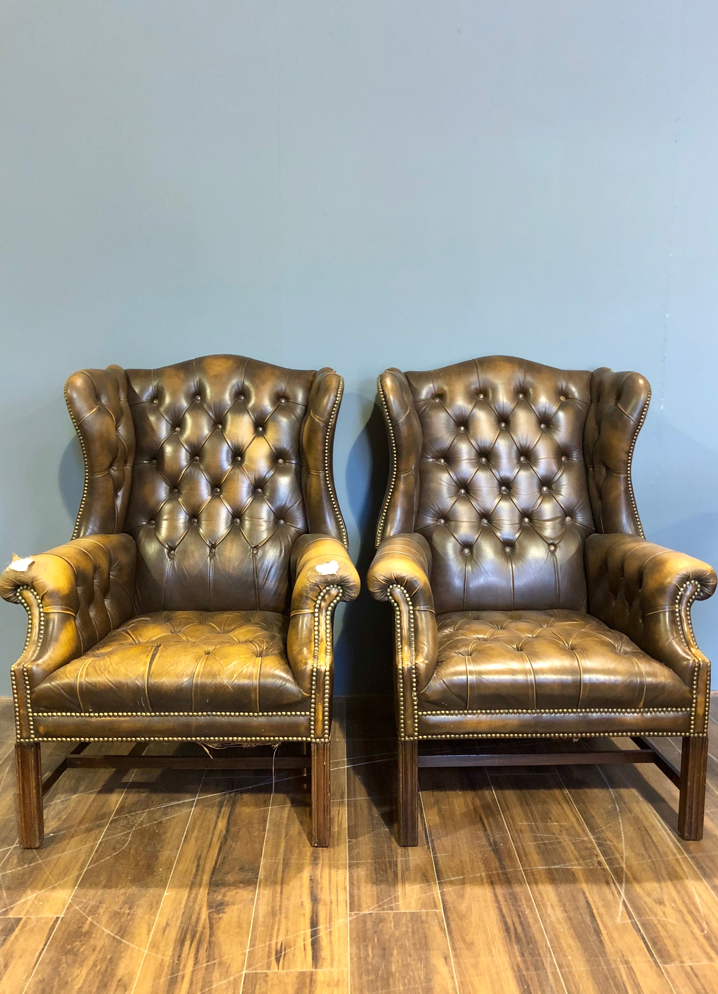 A Super Matching Pair of Vintage Leather Chesterfield Wing Back Chairs