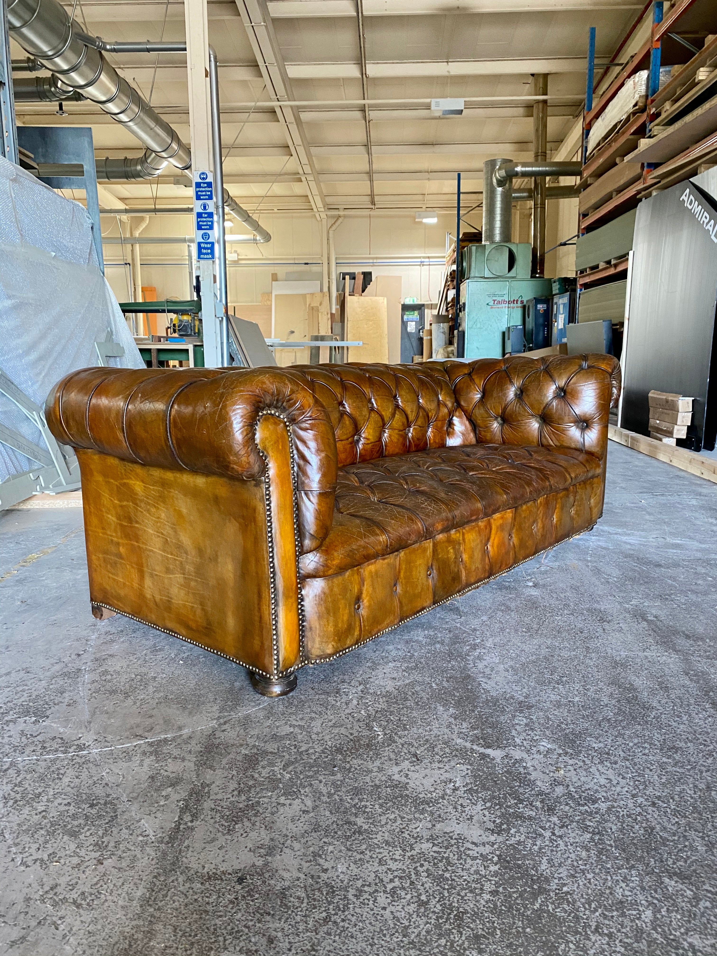 A Very Warm MidC Vintage Leather Chesterfield Sofa