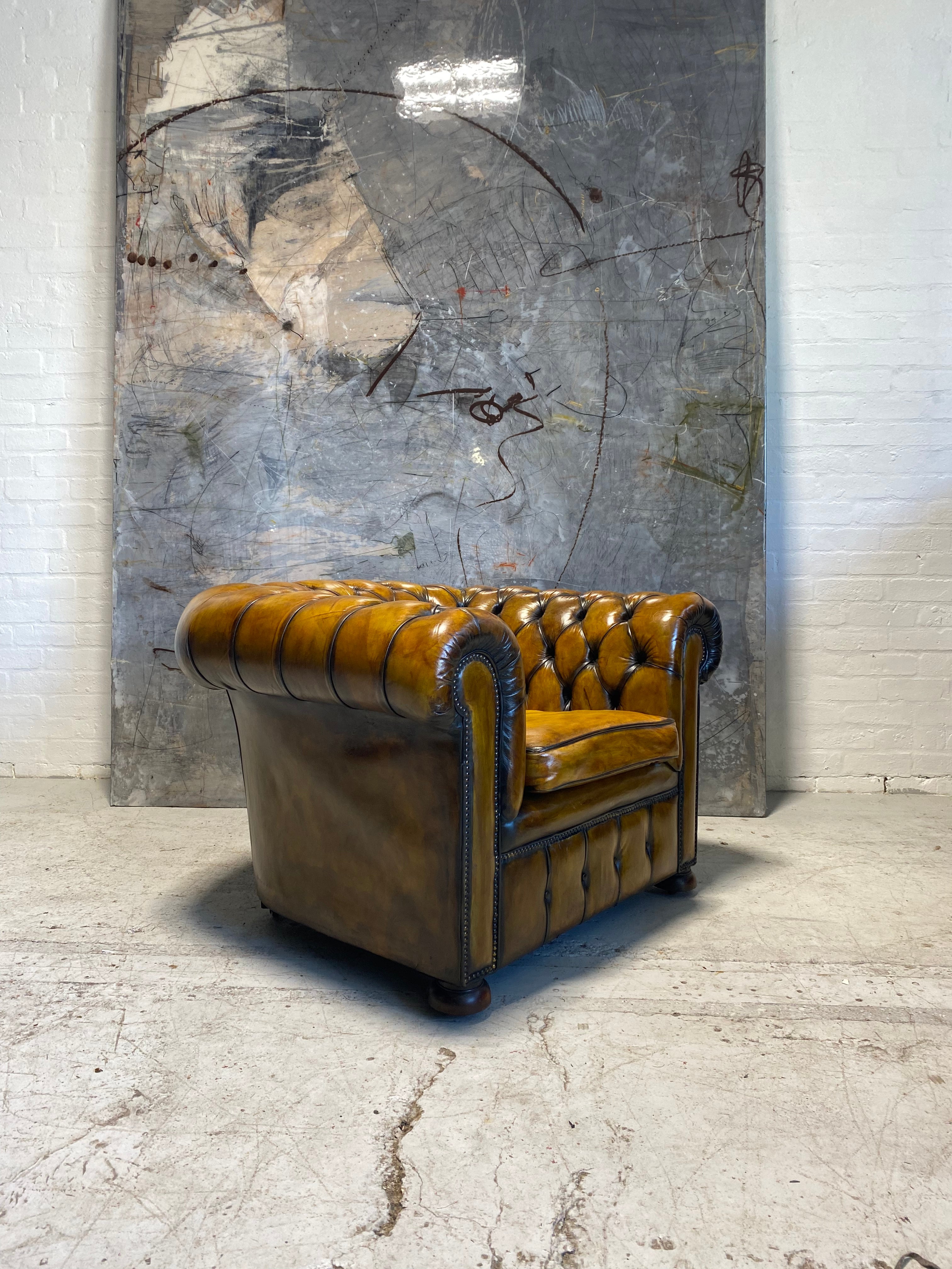 An amazing Matching Pair of Golden Tan MidC Chesterfield Club Chairs