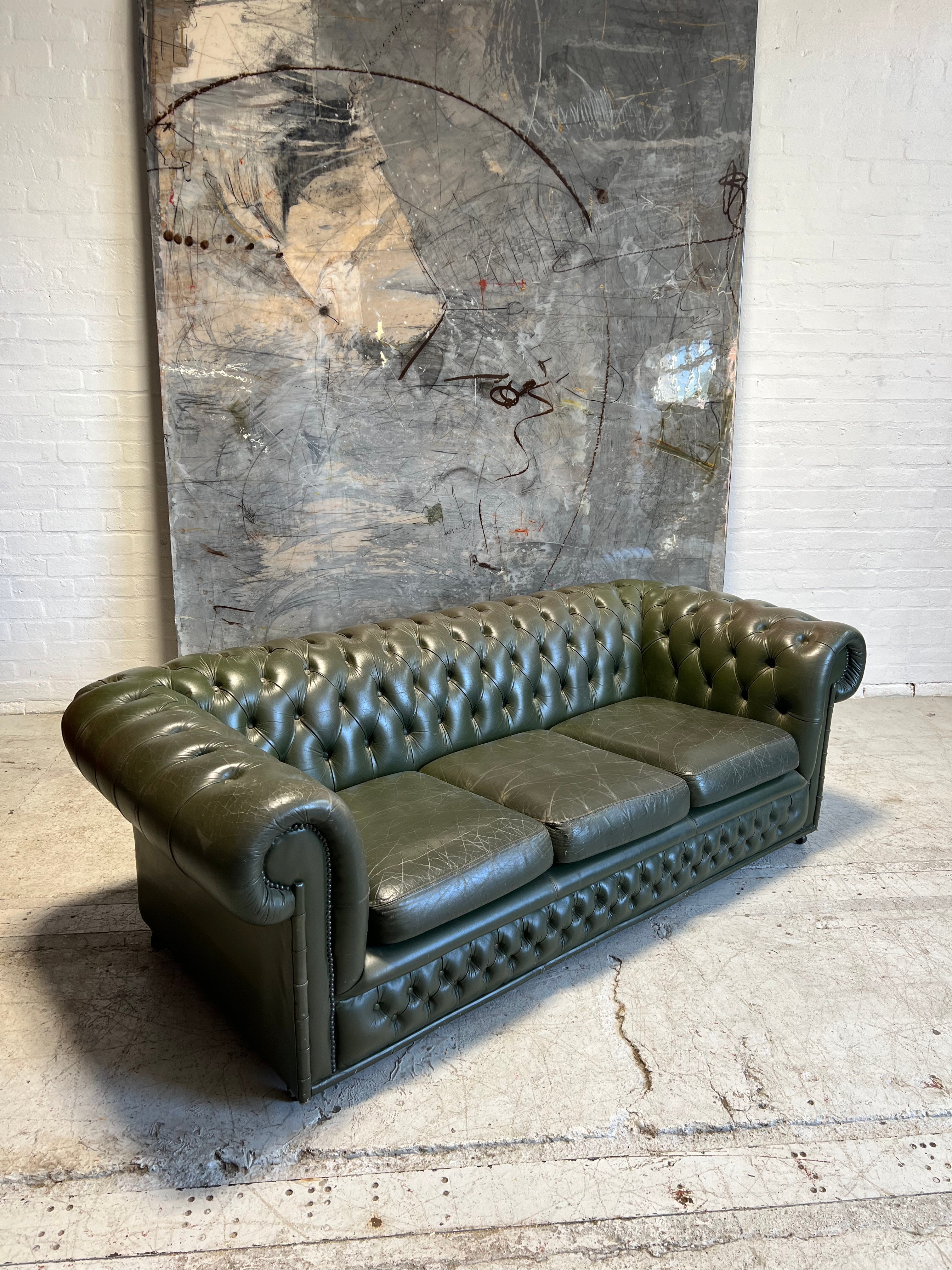 One of a Pair - a Very Smart Military Green Leather Chesterfield Sofa