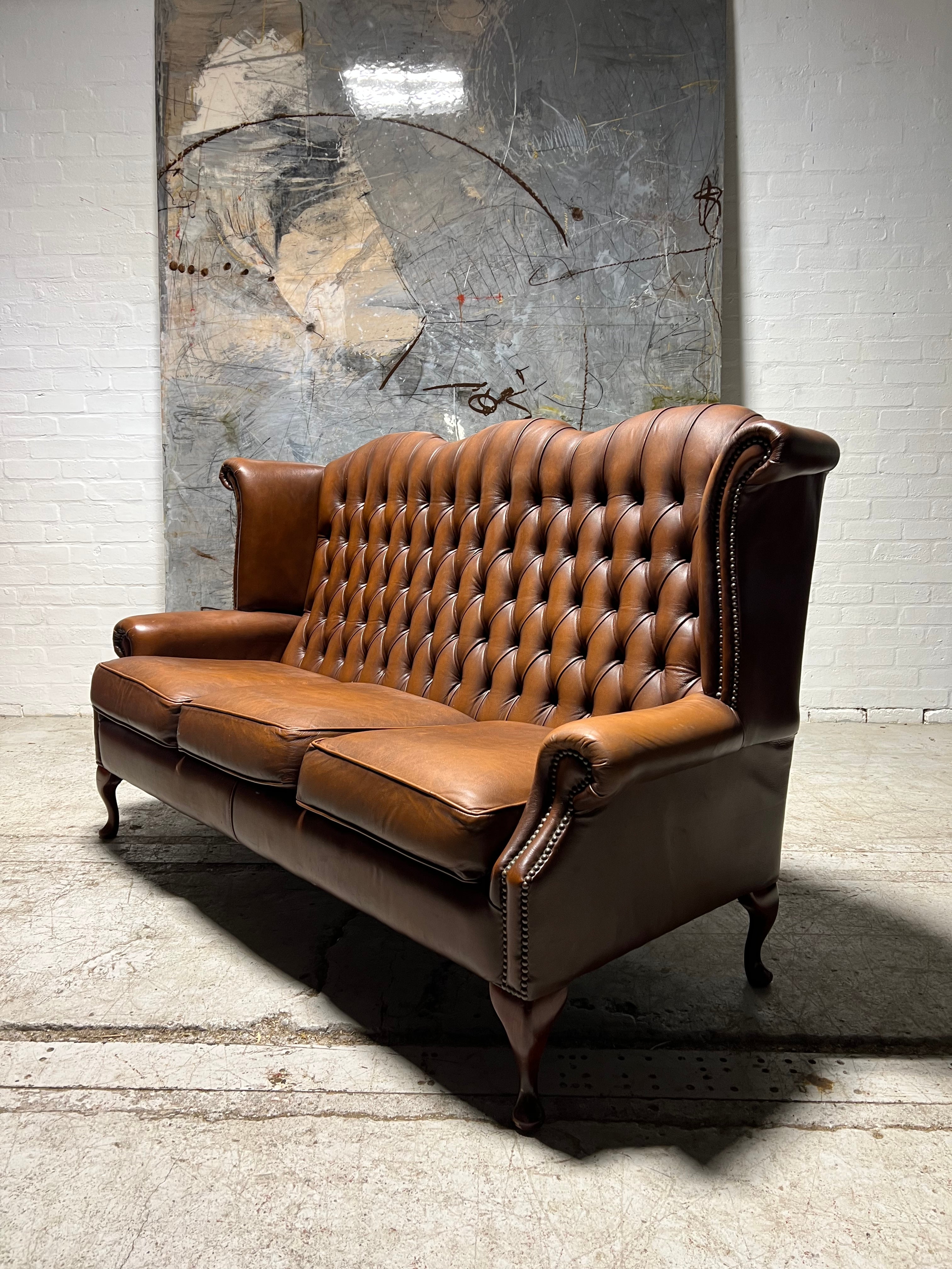 Beautiful Pair of Twice loved Chesterfield Wing Back Sofas in Caramel Tan