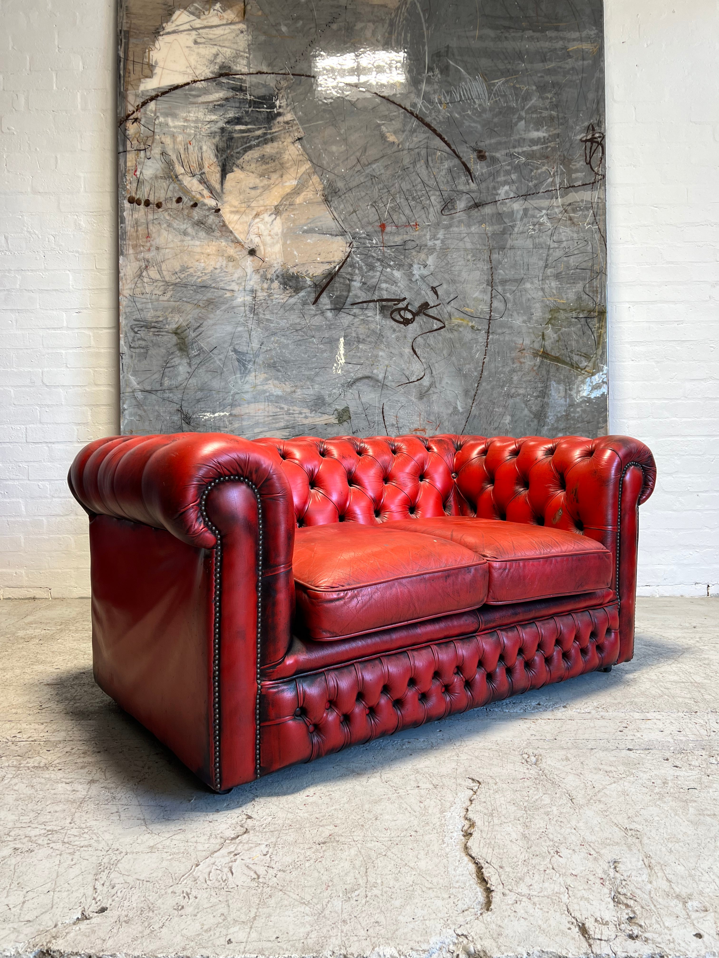 A Lovely Little 2 Seater Leather Chesterfield Sofa in Red